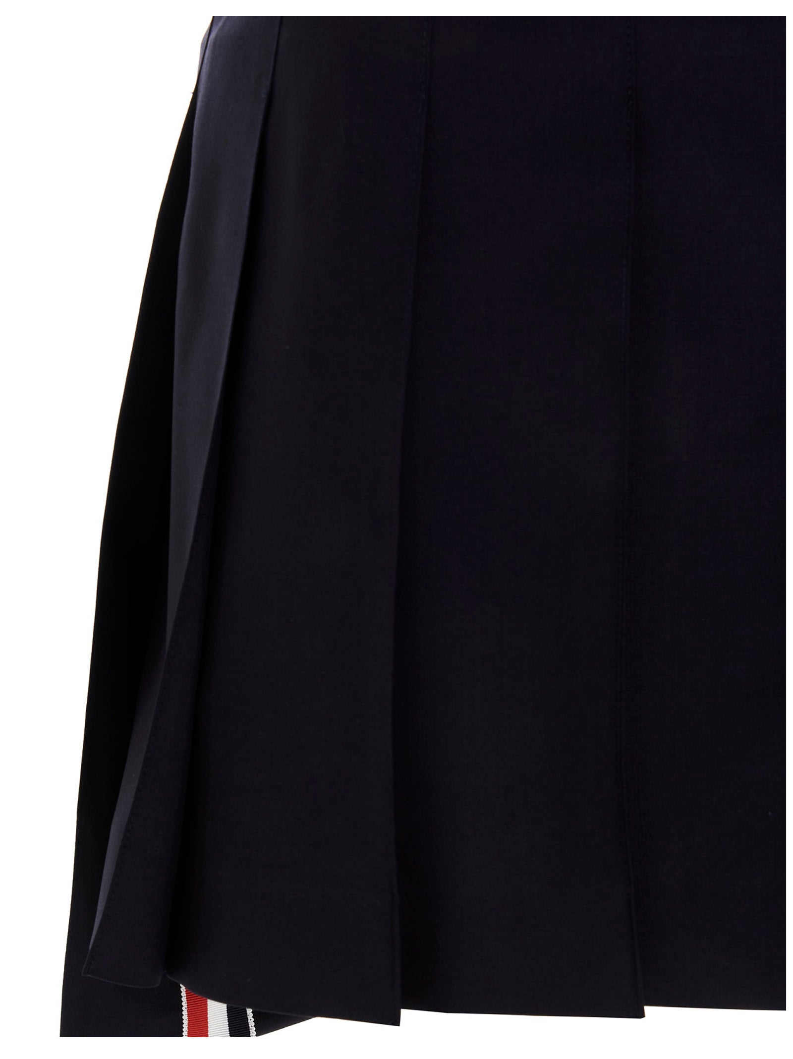 Discover the Thom Browne Blue Wool Long Skirt, a masterpiece of artisanal elegance crafted from luxurious 100% wool, perfect for those who embody sophistication and style.