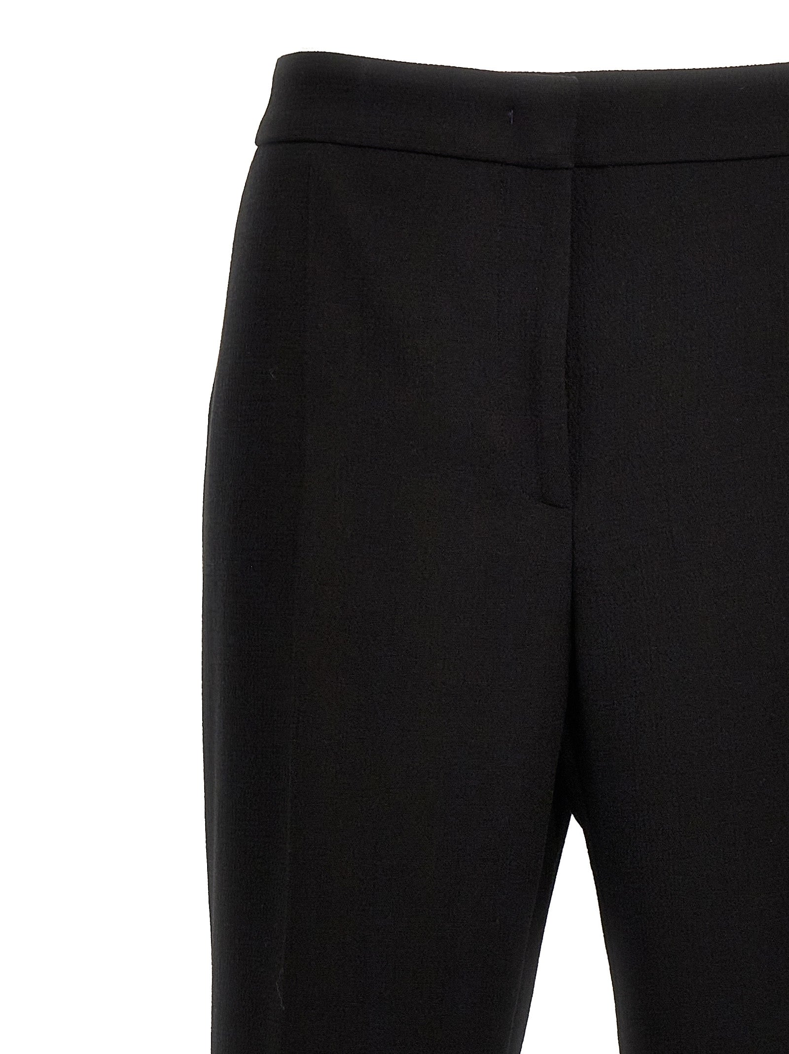 Elevate your wardrobe with Moschino's Black Viscose Dress Pants, a testament to artisanal luxury, crafted in Italy for the discerning individual who values elegance and sophistication.