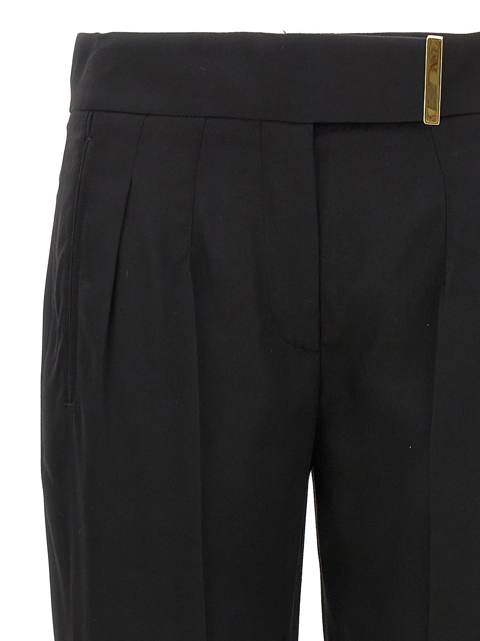 Elevate your elegance with Tom Ford's black viscose dress pants, a luxurious blend of sophistication and craftsmanship, perfect for any refined occasion.