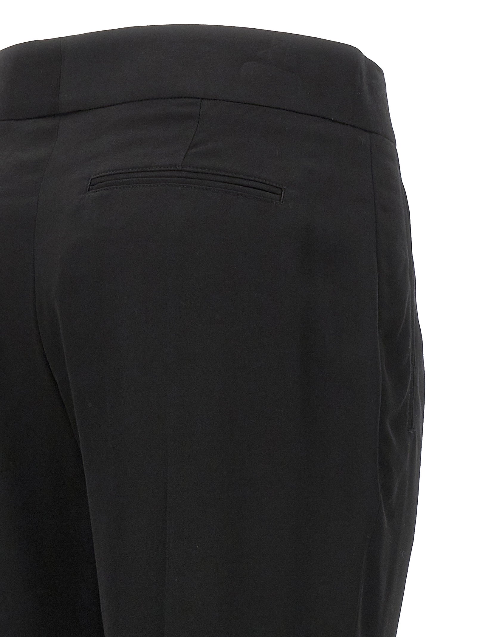 Discover the allure of Tom Ford's Black Viscose Dress Pants, where exquisite craftsmanship meets timeless elegance, perfect for elevating any sophisticated wardrobe.
