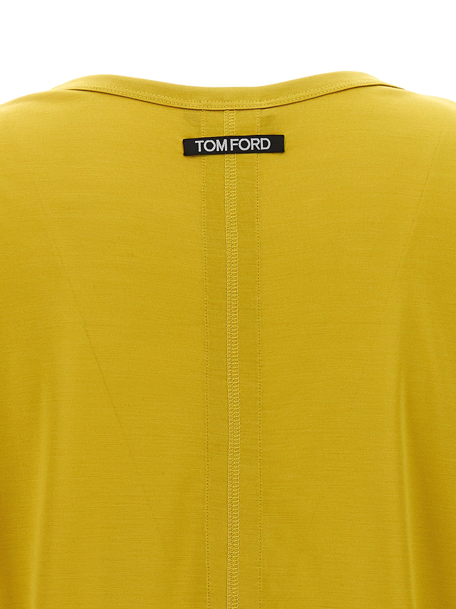 Experience the allure of Tom Ford's Bicolor Silk T-Shirt, a masterpiece of Italian craftsmanship, blending luxury and elegance for the discerning individual.