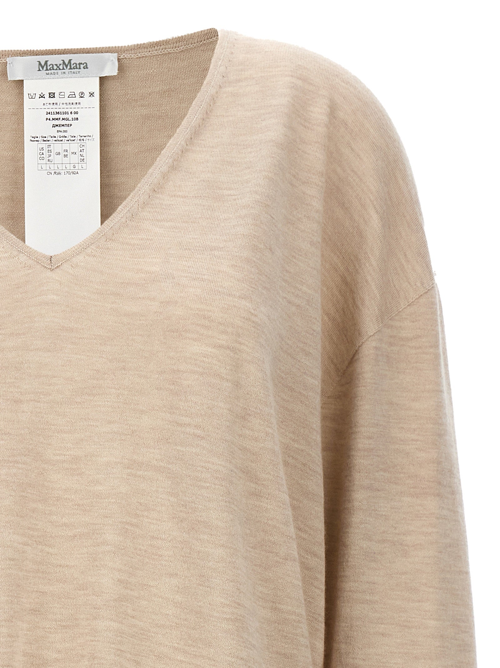 Experience the exquisite allure of the Max Mara Beige Cashmere Cardigan, a timeless masterpiece crafted from 100% cashmere, embodying Italian elegance and sophistication.