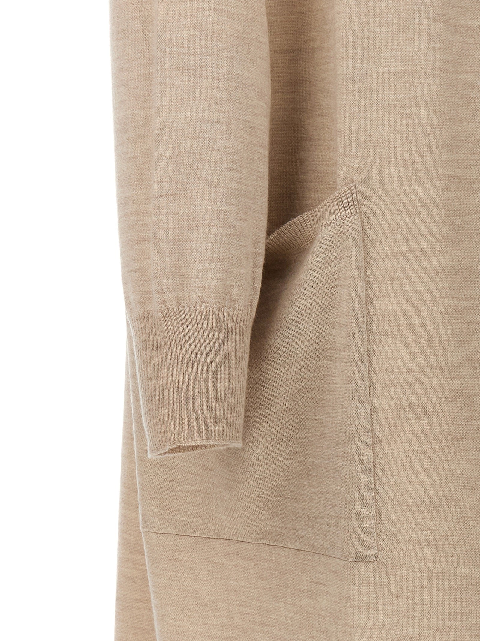 Elevate your wardrobe with the Max Mara Beige Cashmere Cardigan, a luxurious Italian piece crafted from 100% cashmere, embodying timeless elegance and sophistication.