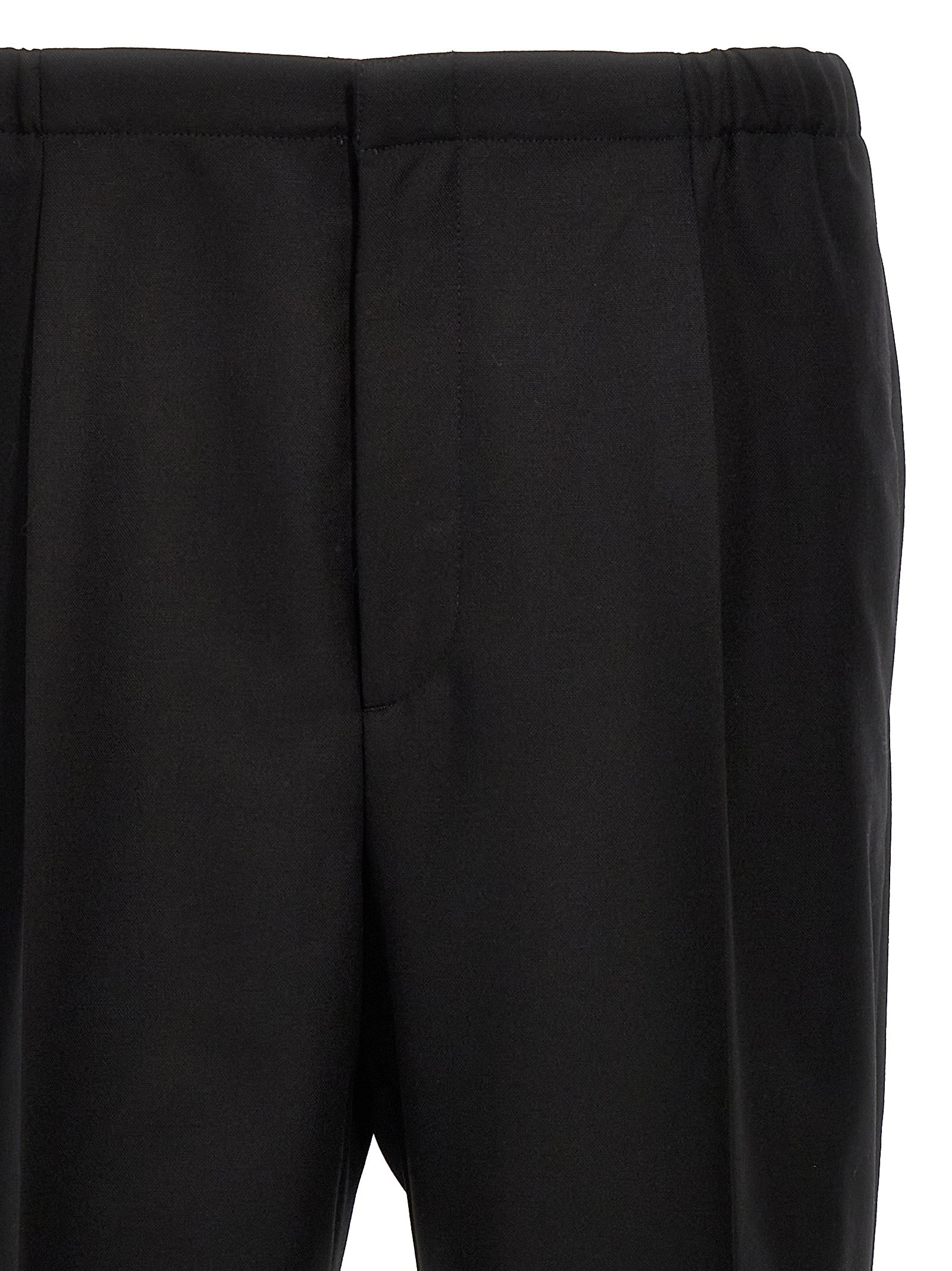 Indulge in the luxurious allure of Fendi's Black Virgin Wool Dress Pants, where exquisite craftsmanship meets timeless elegance, perfect for the discerning connoisseur.