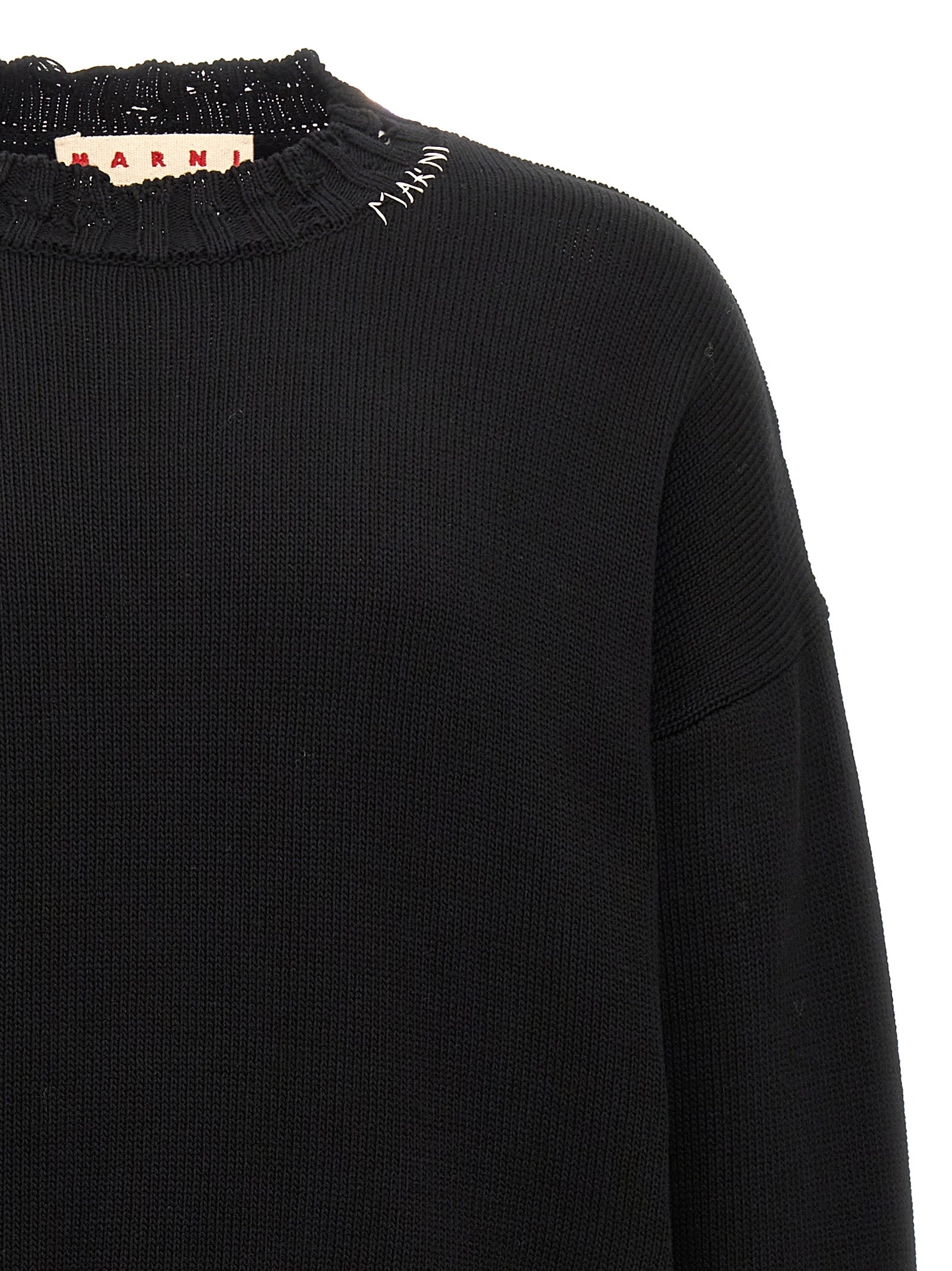Elevate your wardrobe with the Marni Black Cotton Cardigan, a luxurious blend of artisanal craftsmanship and bold sophistication, perfect for the discerning individual.