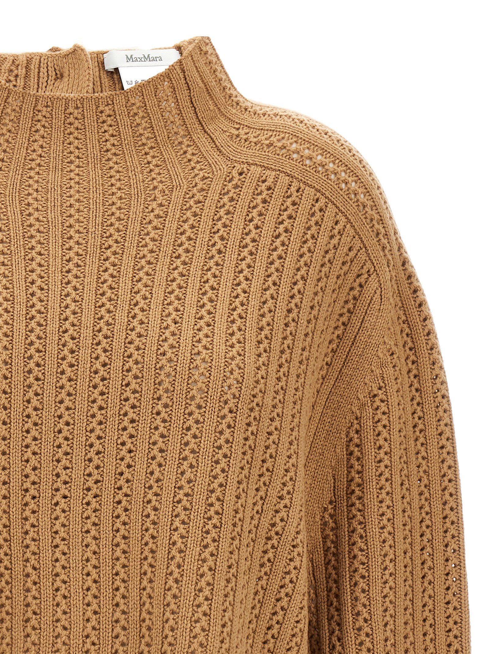 Elevate your style with the Max Mara Beige Wool Cardigan, a luxurious blend of wool and cashmere, embodying artisanal elegance and timeless sophistication.