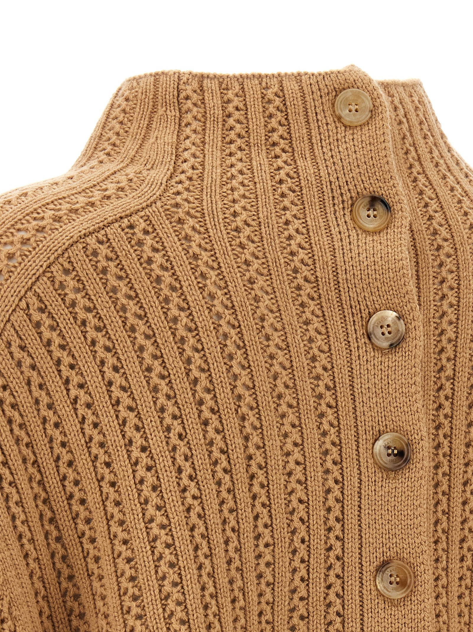 Elevate your wardrobe with the Max Mara Beige Wool Cardigan, a luxurious blend of wool and cashmere, embodying artisanal elegance and timeless sophistication.