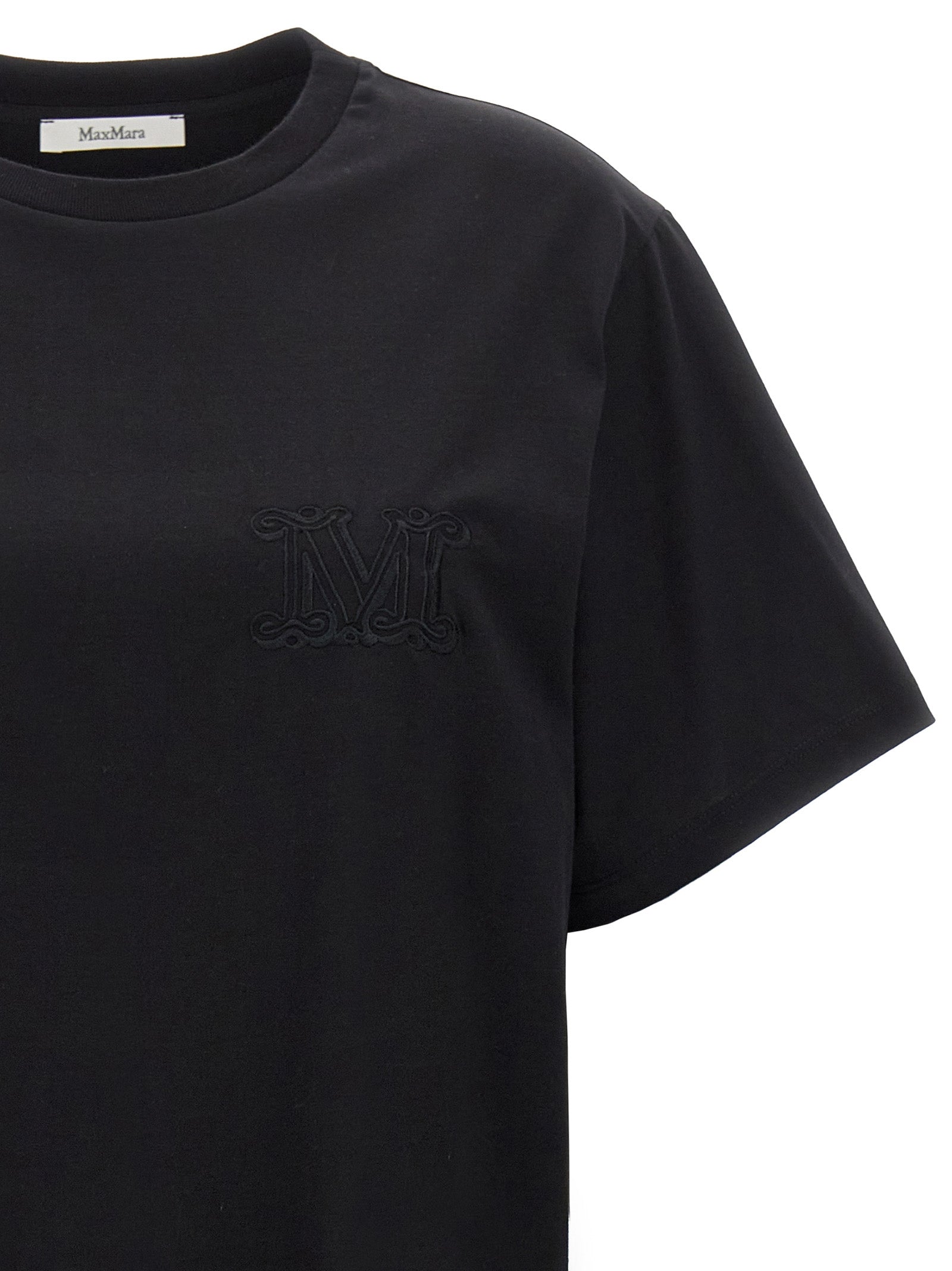 Indulge in the Max Mara Black Cotton T-Shirt, a luxurious staple crafted from premium cotton, embodying timeless elegance and sophistication for the discerning fashionista.