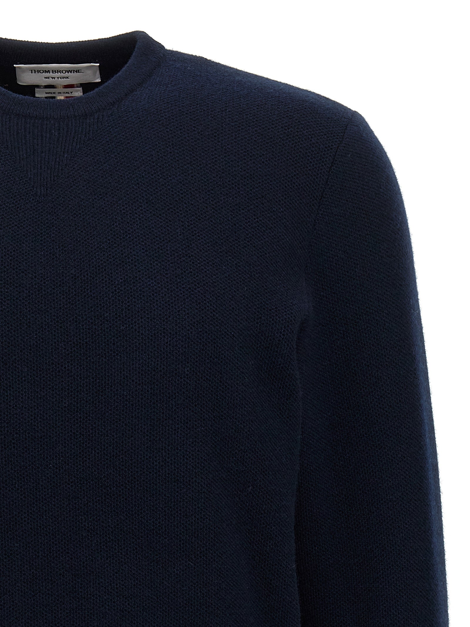 Experience the exquisite craftsmanship of the Thom Browne Blue Virgin Wool Cardigan, where timeless elegance meets luxurious comfort, elevating your style effortlessly.