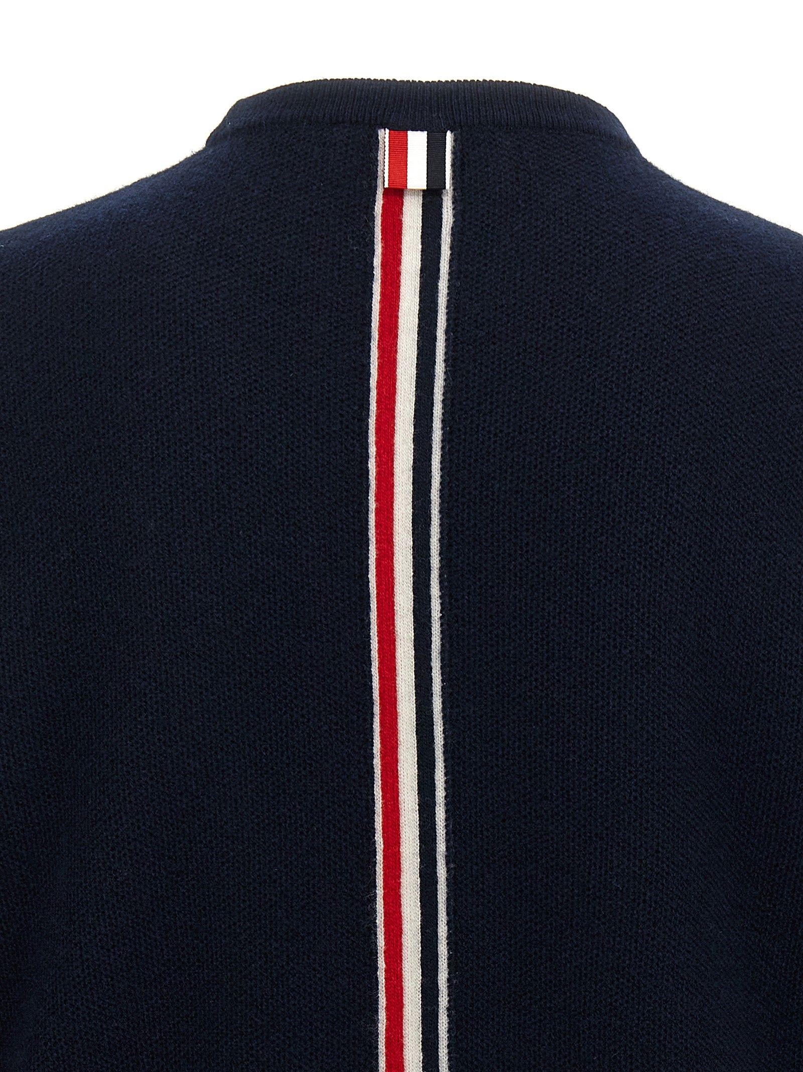 Experience the allure of the Thom Browne Blue Virgin Wool Cardigan, where exquisite craftsmanship meets timeless elegance, elevating your style to unparalleled heights.