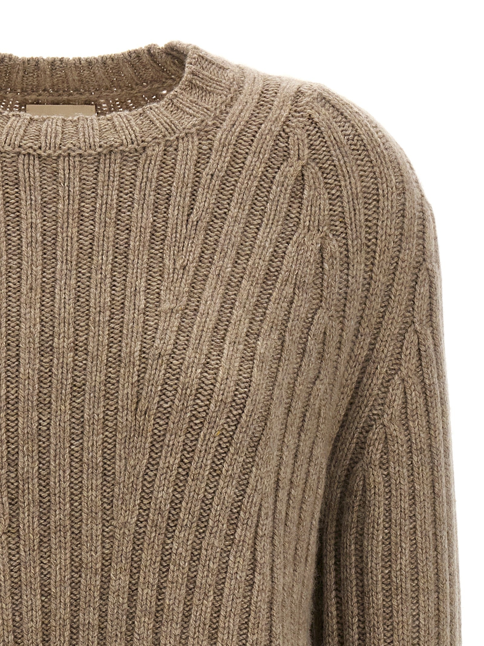 Indulge in the Khaite Beige Cashmere Cardigan, a masterpiece of Mongolian cashmere, embodying timeless elegance and unparalleled luxury for the discerning individual.