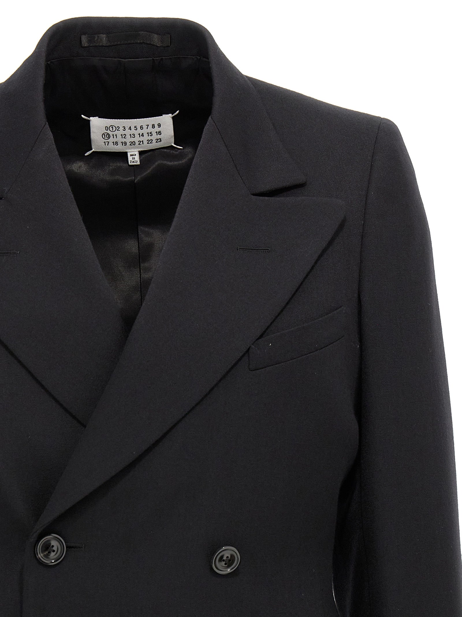 Discover the Maison Margiela Black Wool Blazer, a masterpiece of artisanal elegance crafted from 100% wool, perfect for elevating your sophisticated style.