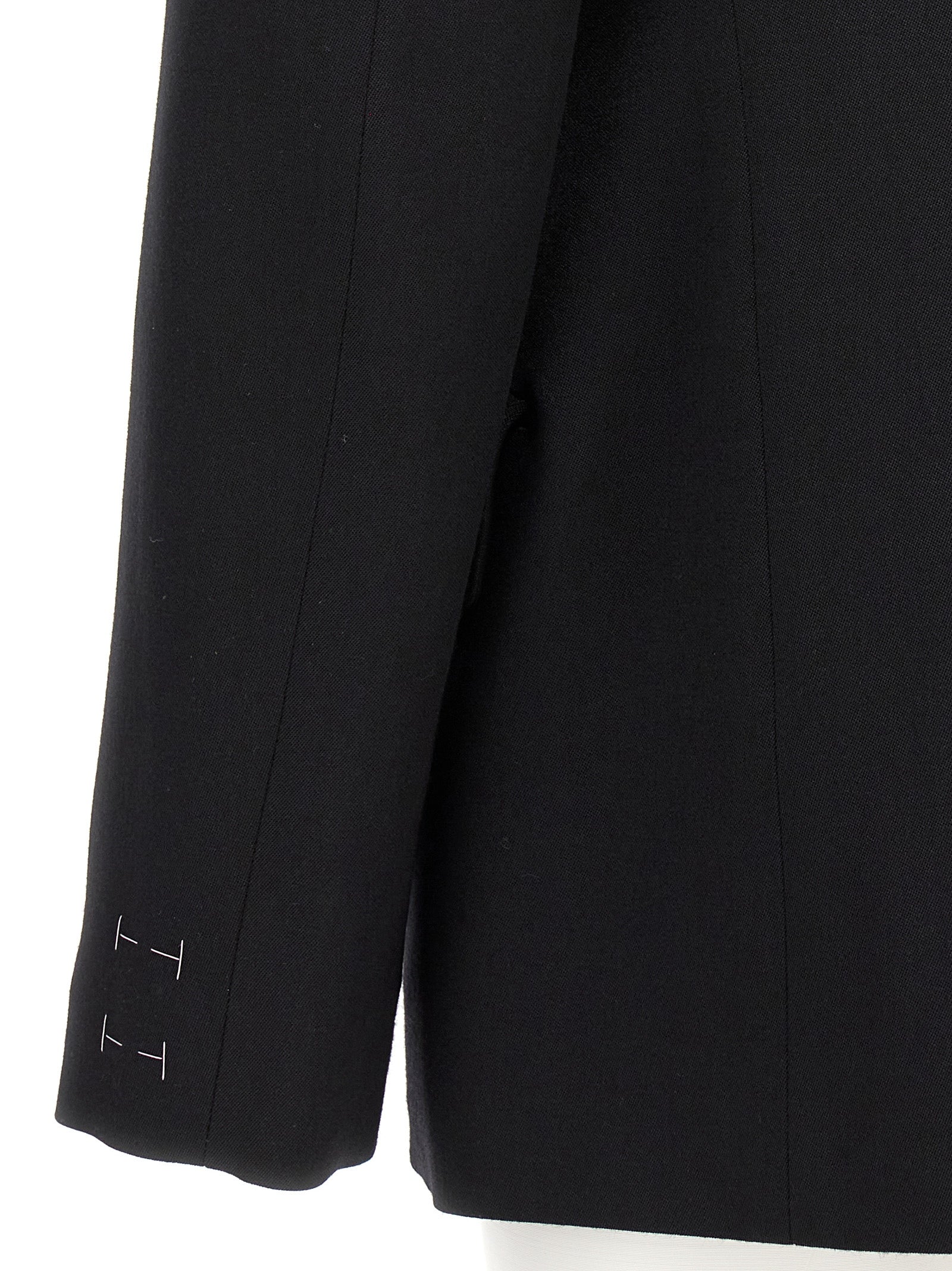 Experience the artisanal elegance of the Maison Margiela Black Wool Blazer, crafted from 100% wool in Italy, redefining sophistication for every occasion.