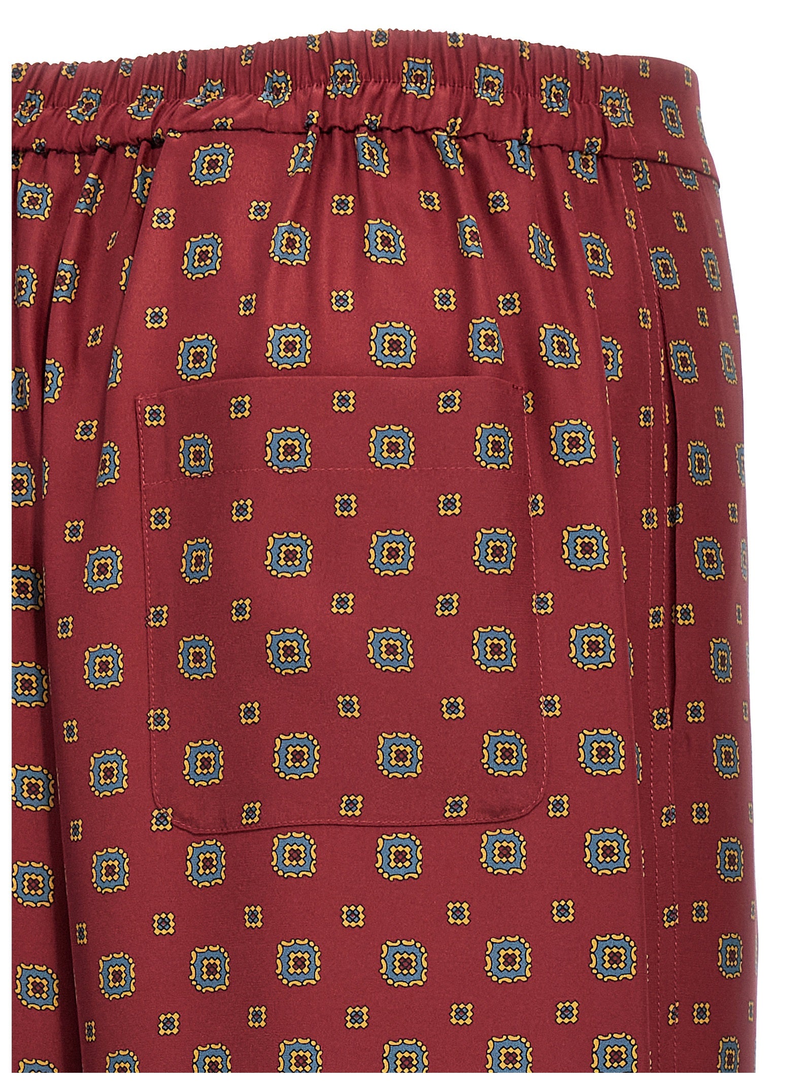 Indulge in the exquisite Moschino Bordeaux Silk Casual Pants, crafted from luxurious silk, embodying elegance and sophistication for the discerning individual.