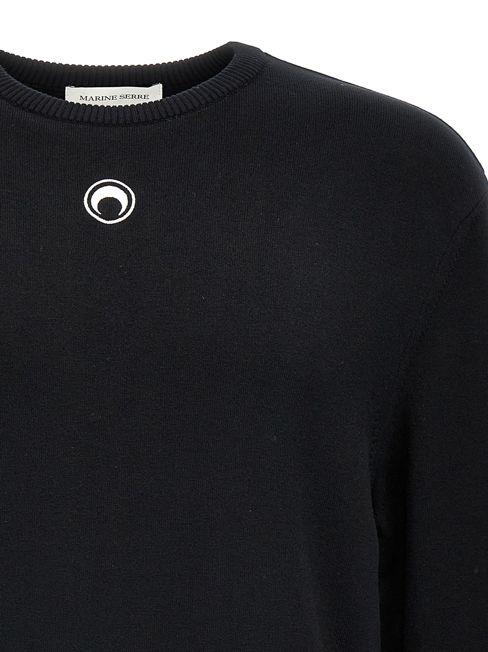 Indulge in the Marine Serre Black Viscose Cardigan, a luxurious blend of stretch viscose and elegance, perfect for those who embrace individuality and sophistication.