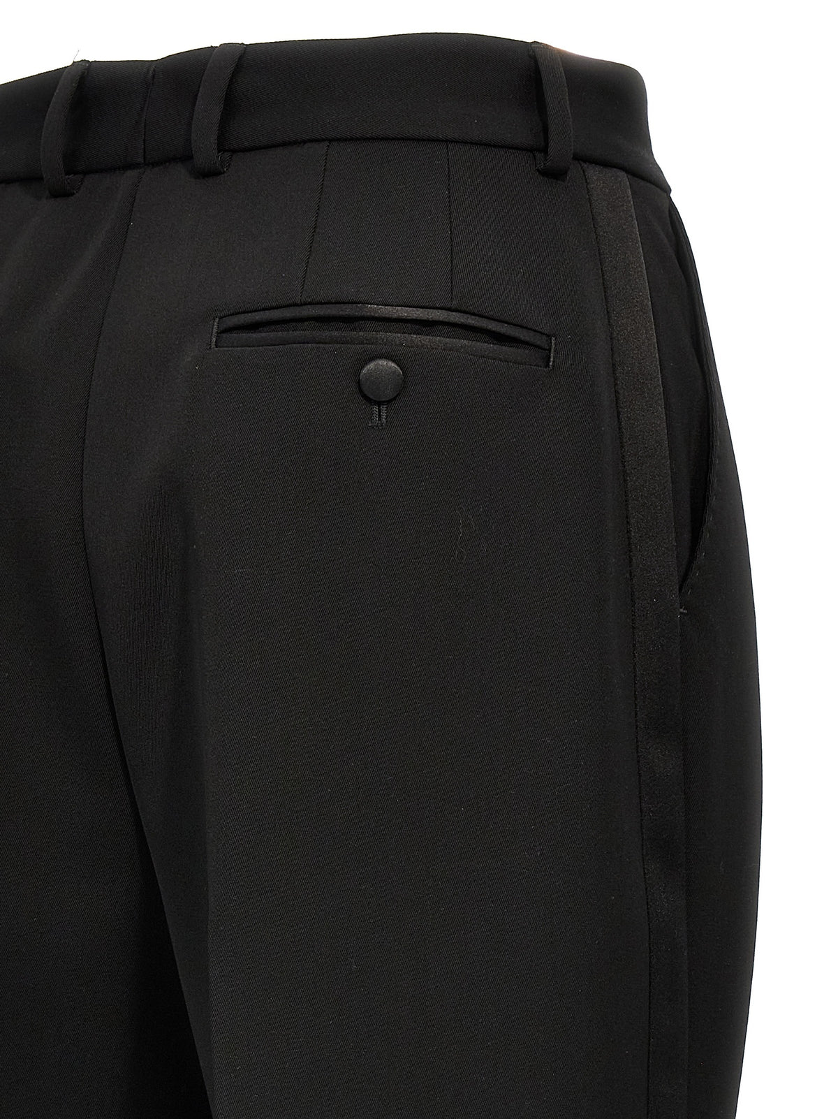 Elevate your wardrobe with the Dolce & Gabbana Black Virgin Wool Tuxedo, a masterpiece of Italian craftsmanship, blending luxurious wool and silk for timeless sophistication.