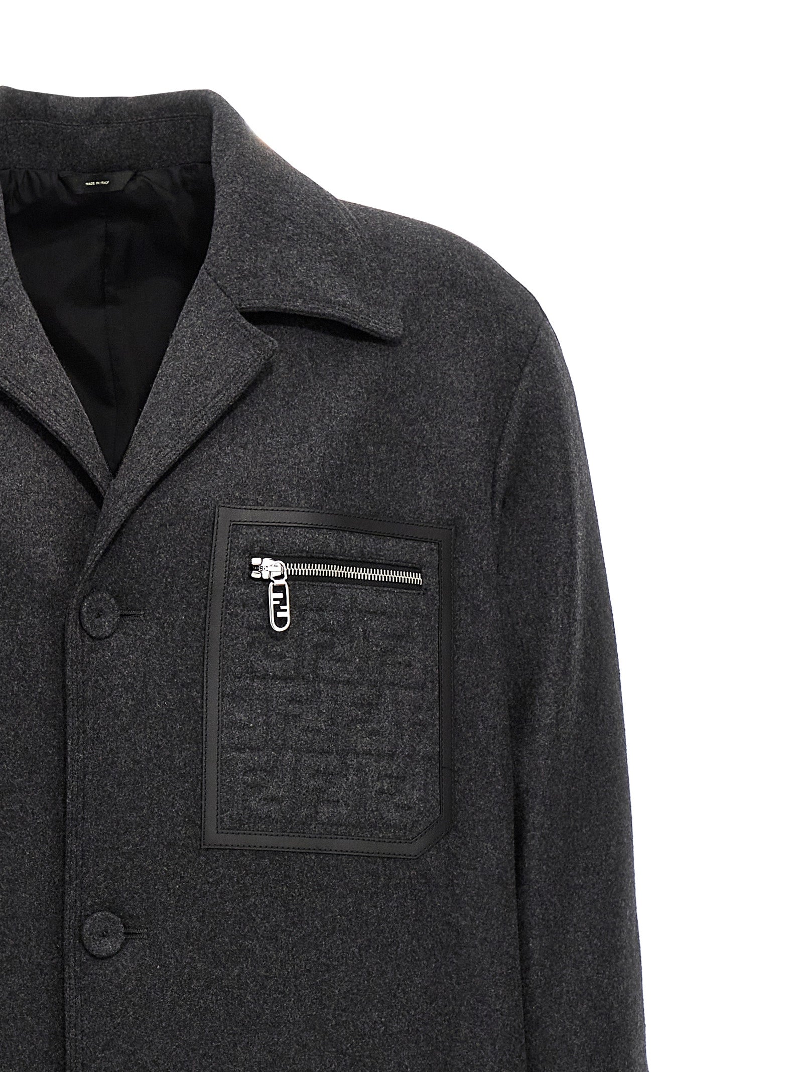 Indulge in the Fendi Gray Cashmere Coat, a masterpiece of Italian craftsmanship, blending luxurious cashmere with timeless elegance for the discerning individual.