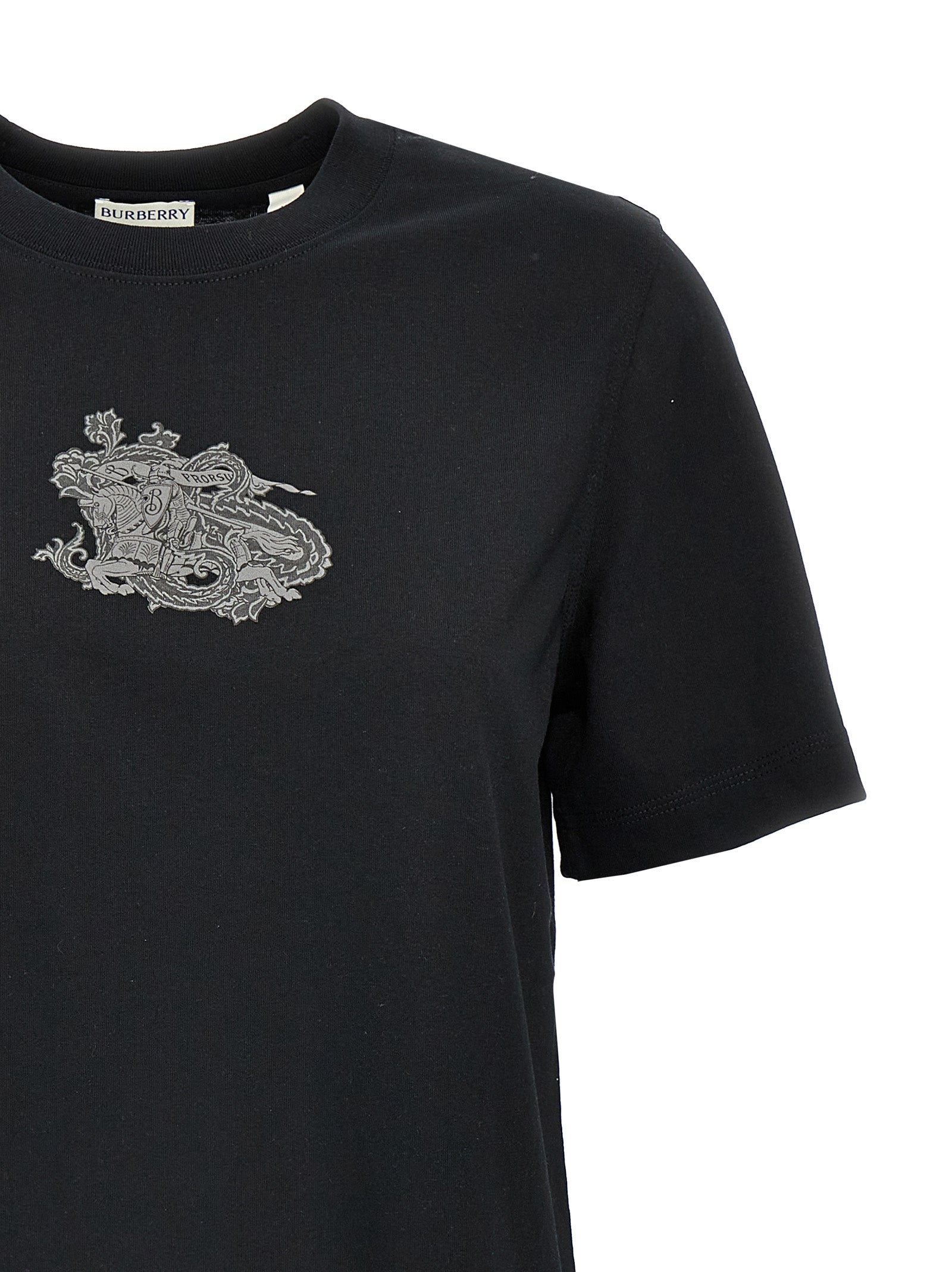Experience the epitome of sophistication with the Burberry Black Cotton T-Shirt, crafted from luxurious 100% cotton, a timeless staple for the discerning wardrobe.