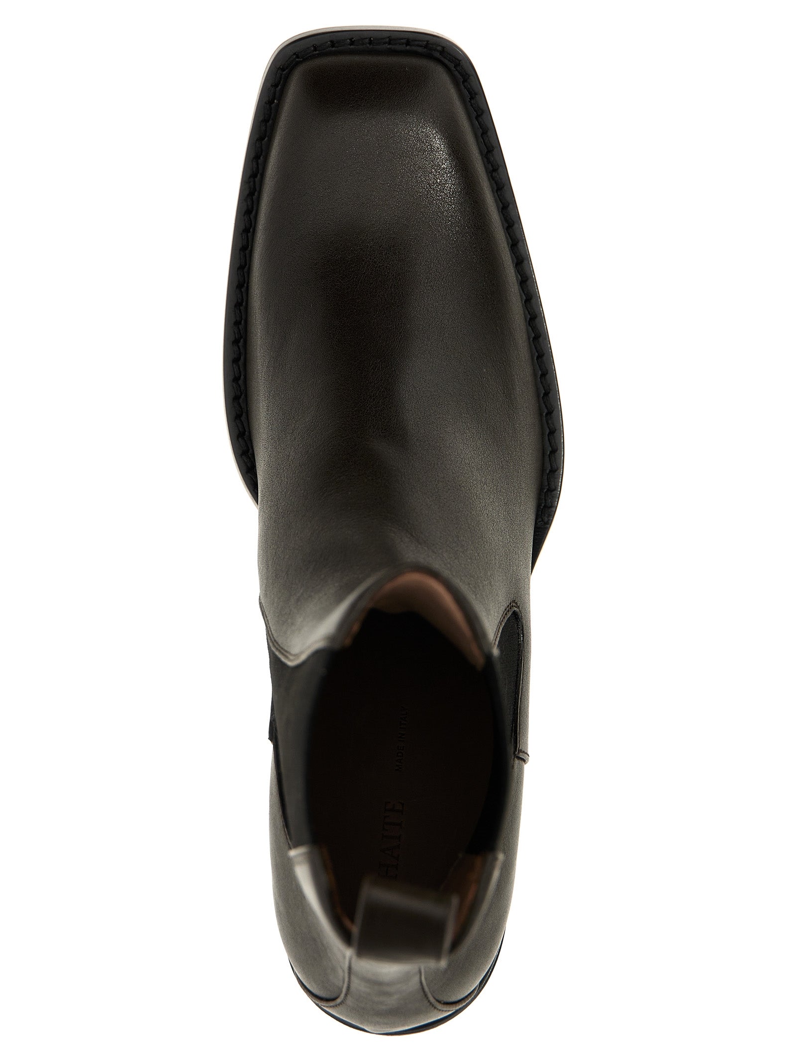 Experience the exquisite craftsmanship of Khaite's Brown Calfskin Chelsea Boots, where luxurious materials and timeless design elevate your style to new heights.