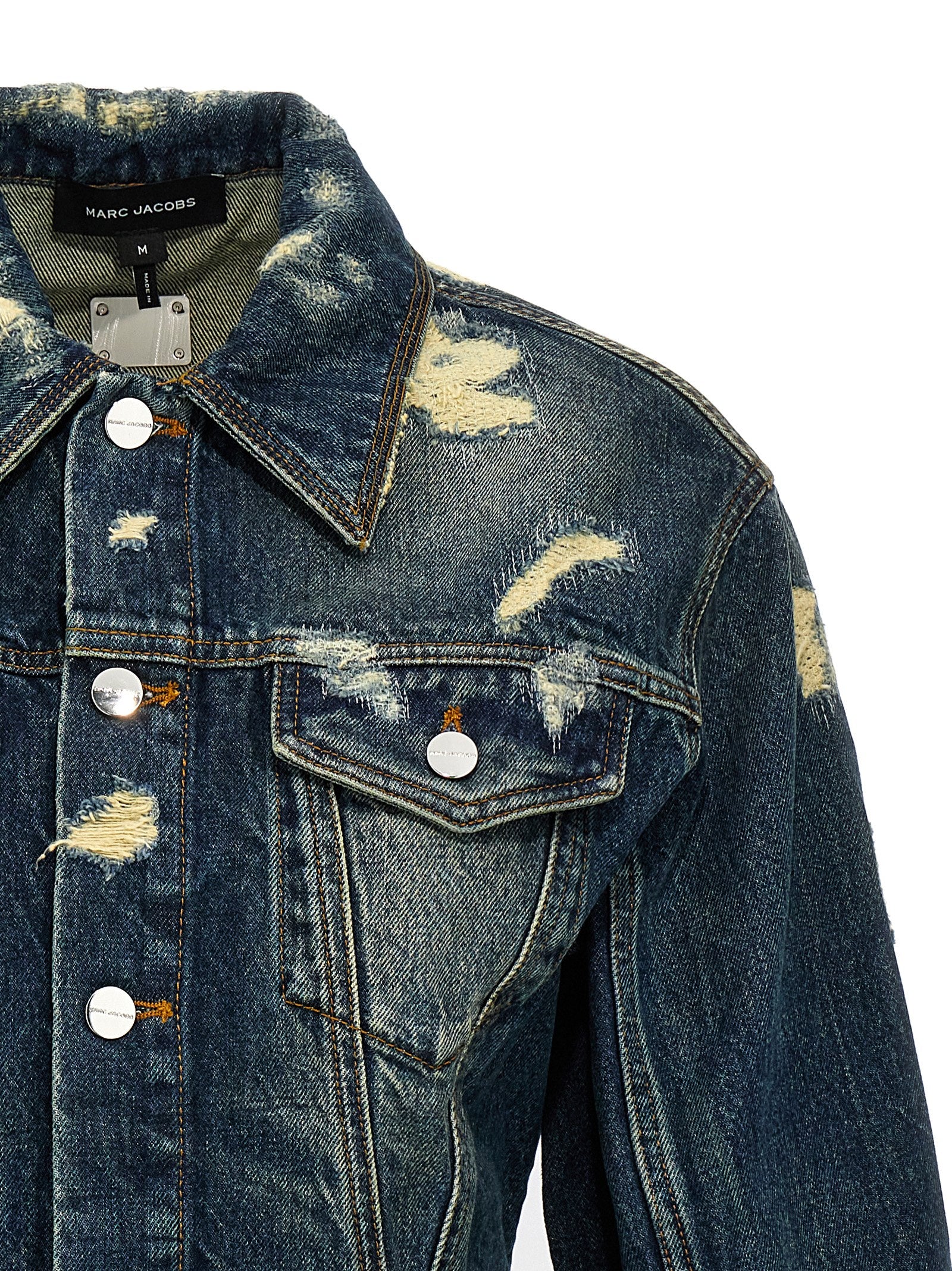 Elevate your wardrobe with the Marc Jacobs Rip and Repair Fluted Denim Jacket, a statement of edgy luxury crafted from 100% cotton, perfect for the discerning fashionista.