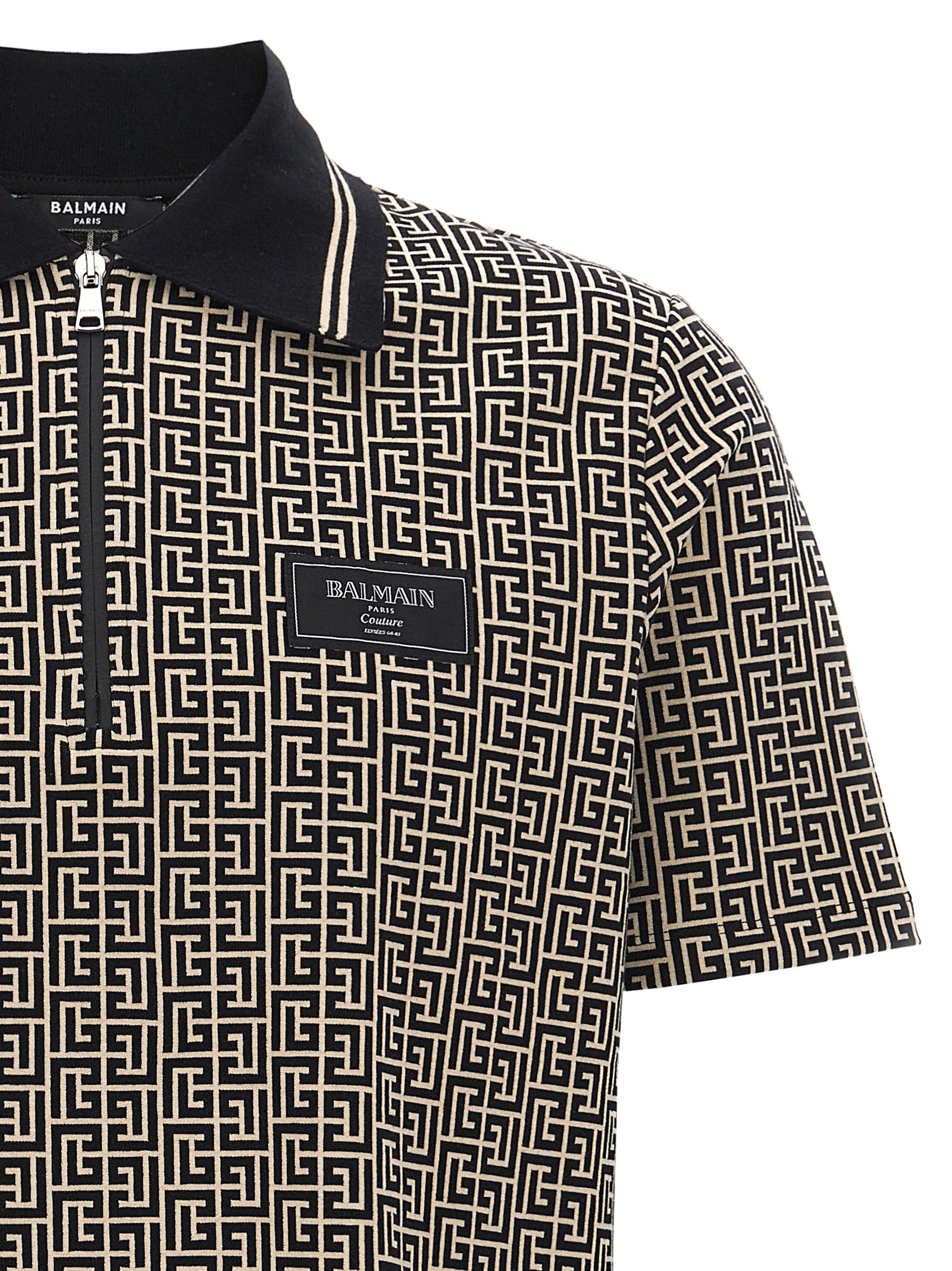 Elevate your wardrobe with the Balmain Bicolor Cotton Polo Shirt, a fusion of artisanal luxury and modern elegance, crafted for the discerning individual.