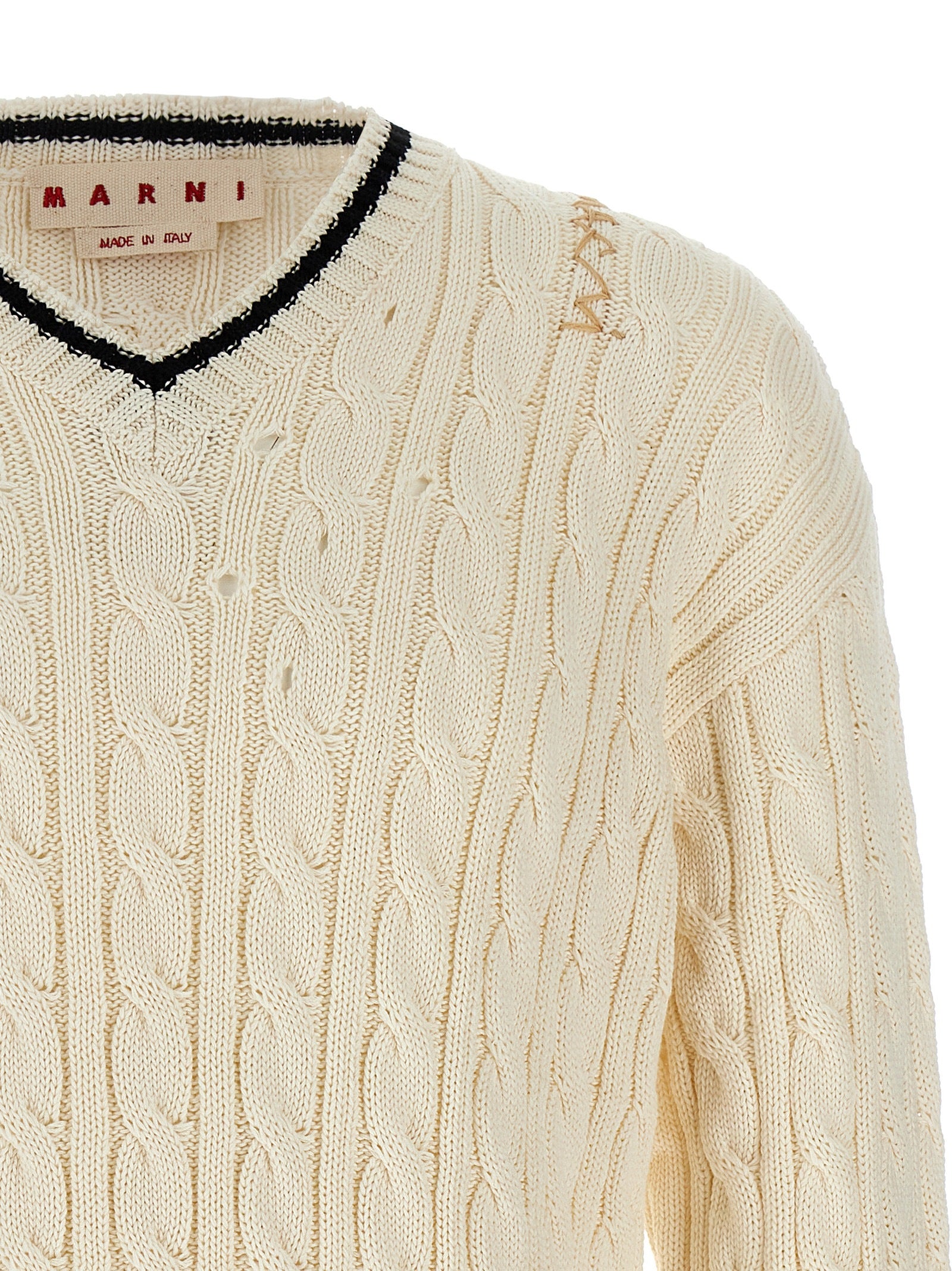 Elevate your wardrobe with the Marni White Cotton Cardigan, an artisanal masterpiece crafted in Italy, merging avant-garde design with timeless elegance for the discerning individual.