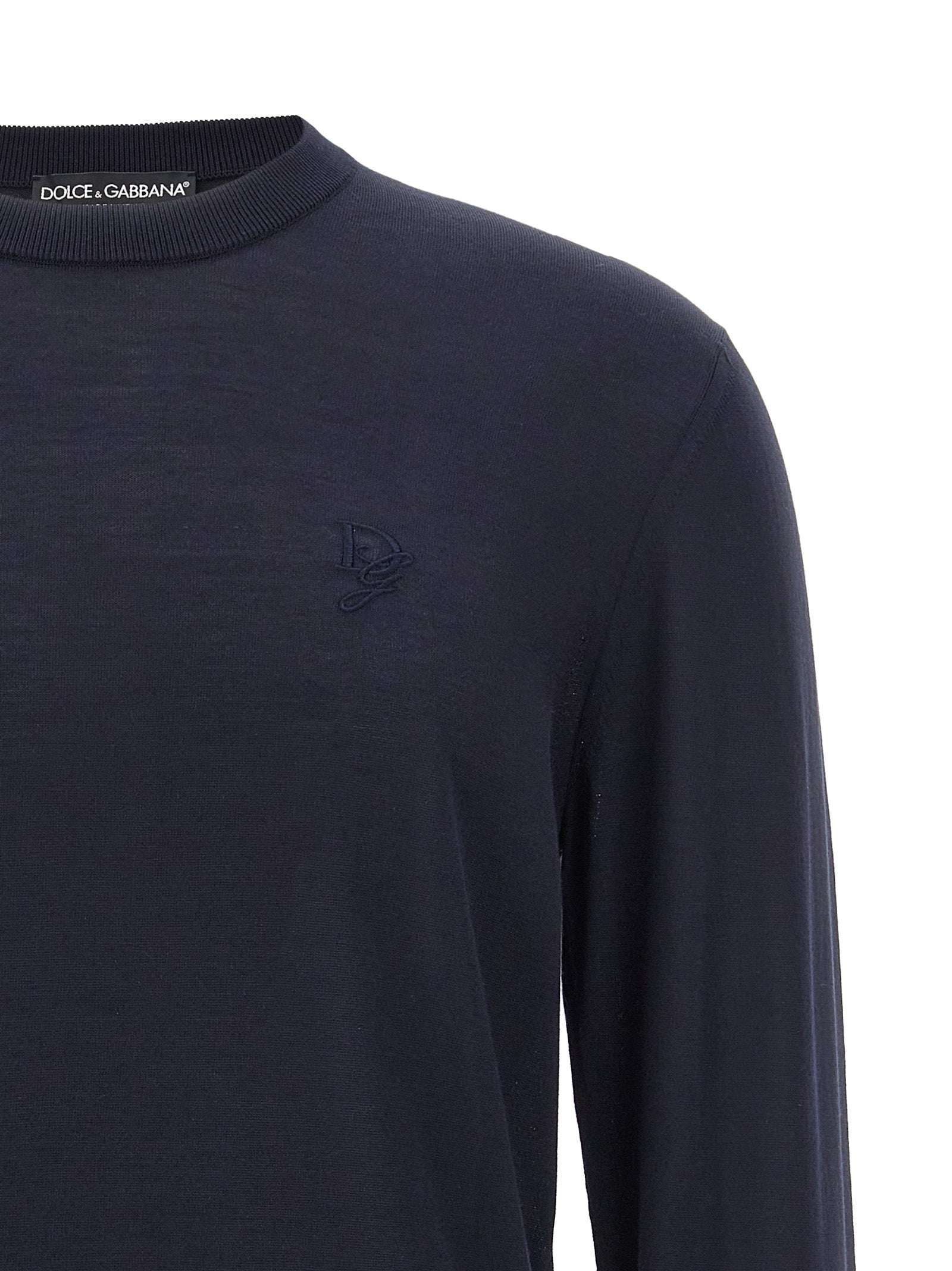 Indulge in the exquisite Dolce & Gabbana Blue Silk Cardigan, a masterpiece of Italian craftsmanship that elevates your wardrobe with timeless luxury and sophistication.