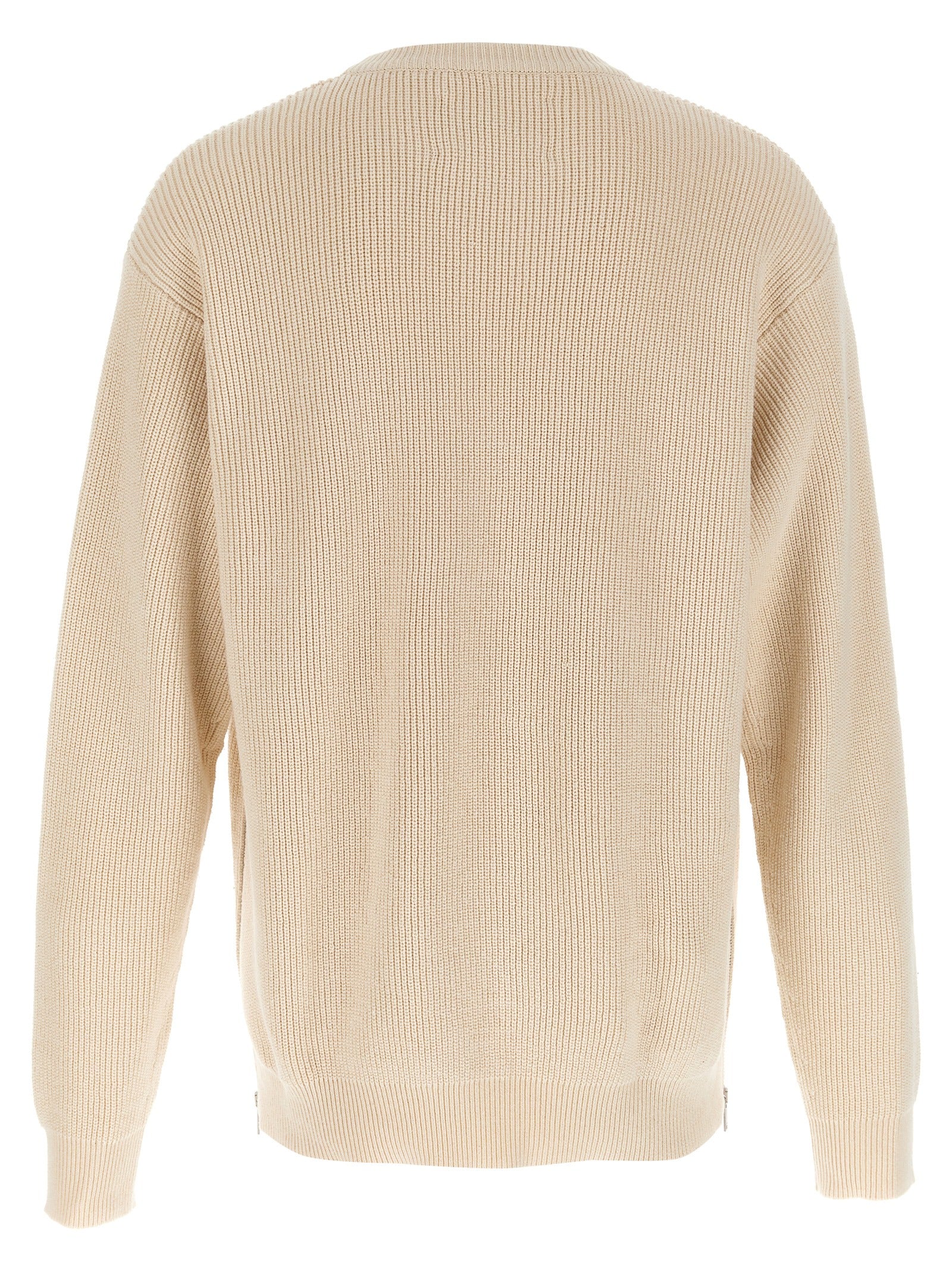 Indulge in the Jil Sander Beige Cotton Cardigan, a luxurious blend of comfort and sophistication, crafted in Italy for timeless elegance and versatile styling.