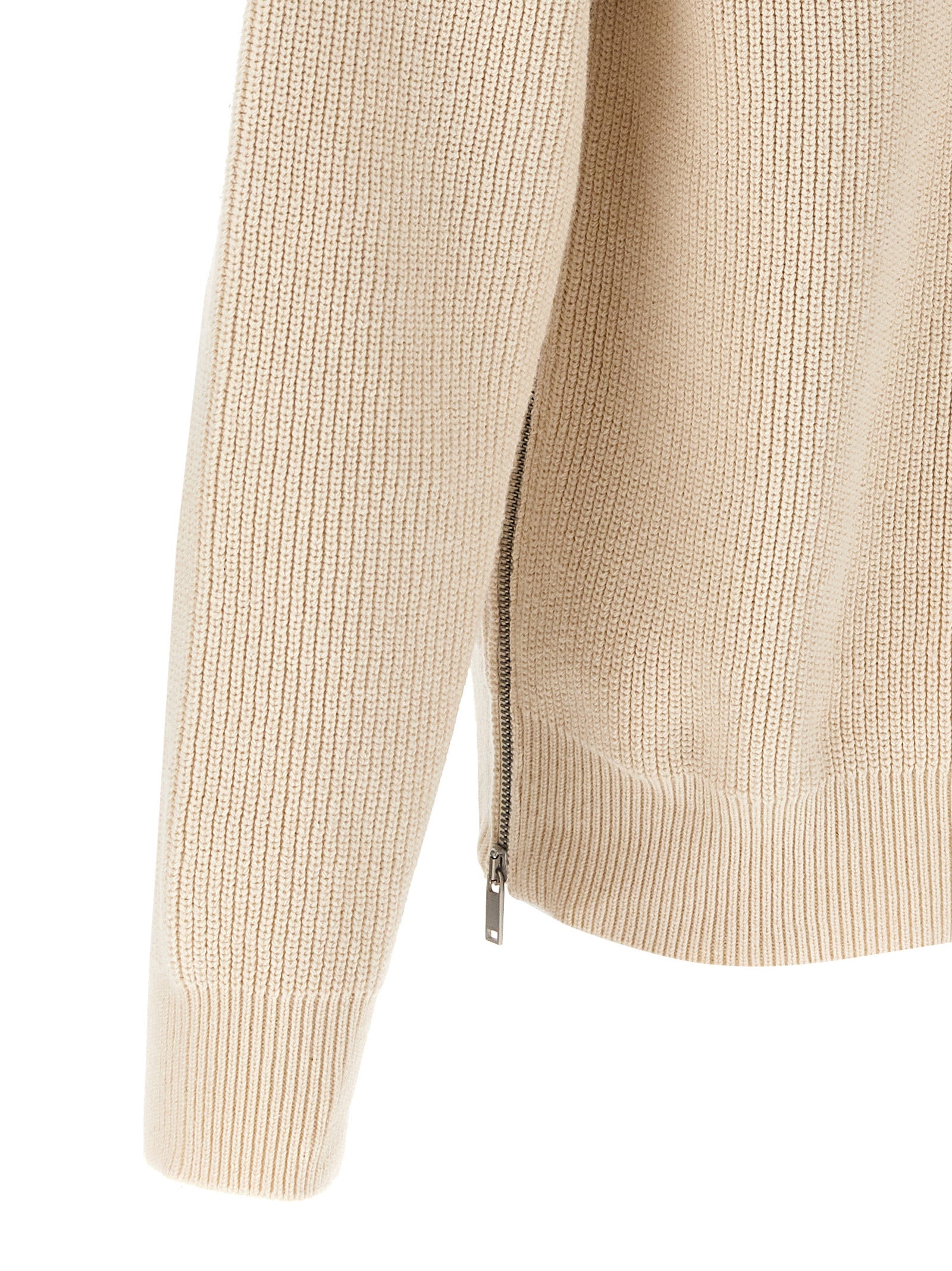 Indulge in the Jil Sander Beige Cotton Cardigan, a masterpiece of luxury knitwear that elevates your style with its exquisite craftsmanship and timeless elegance.
