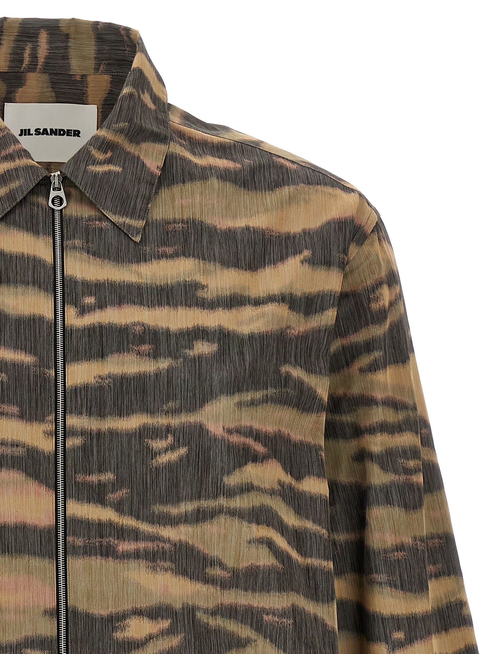 Discover the Jil Sander Multicolor Polyester Blouse, a masterpiece of silk and polyester, blending modern elegance with luxurious comfort for the discerning individual.