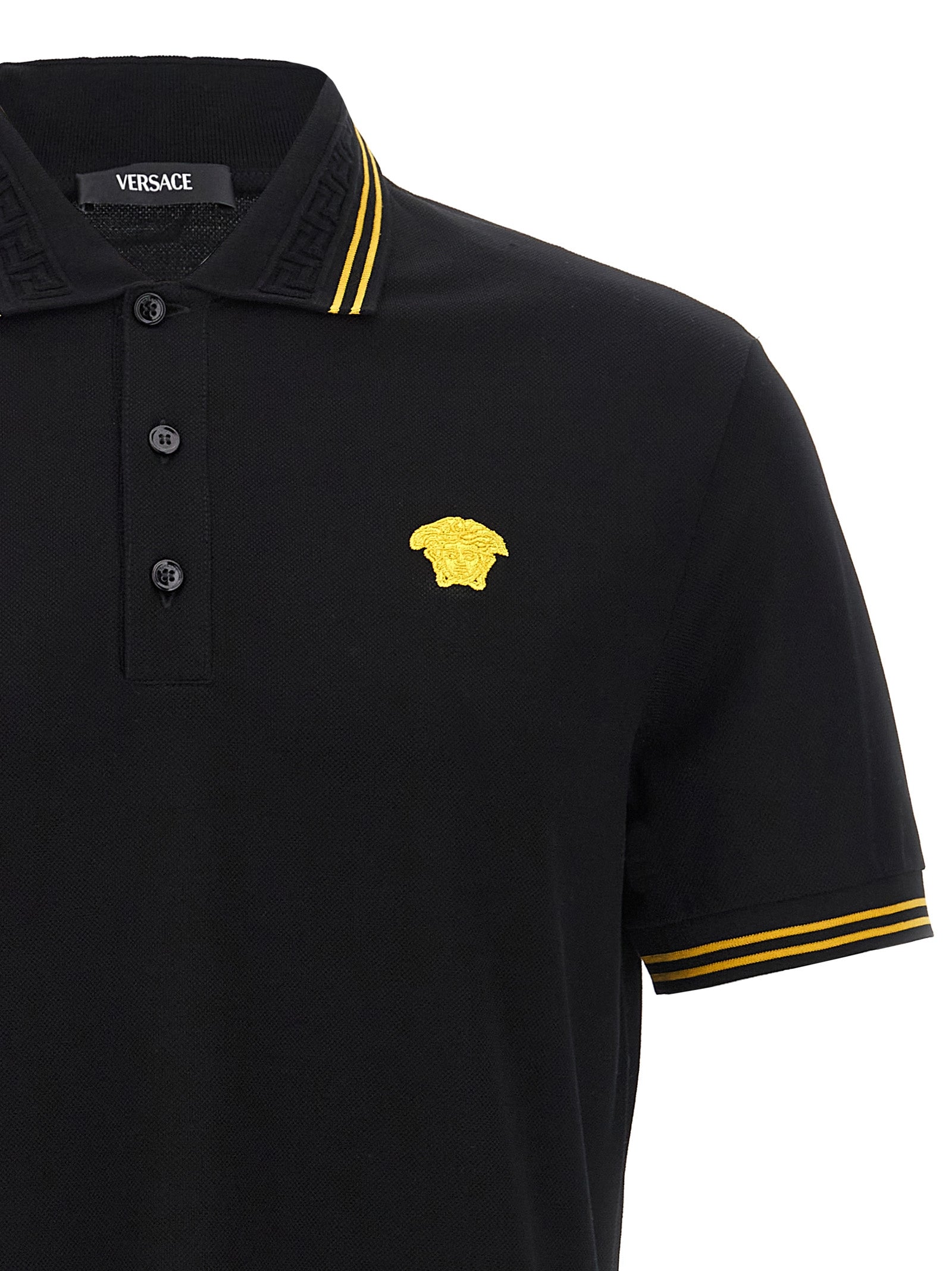 Elevate your style with the Versace Black Cotton Polo Shirt, where exquisite craftsmanship meets timeless luxury, perfect for the discerning individual.