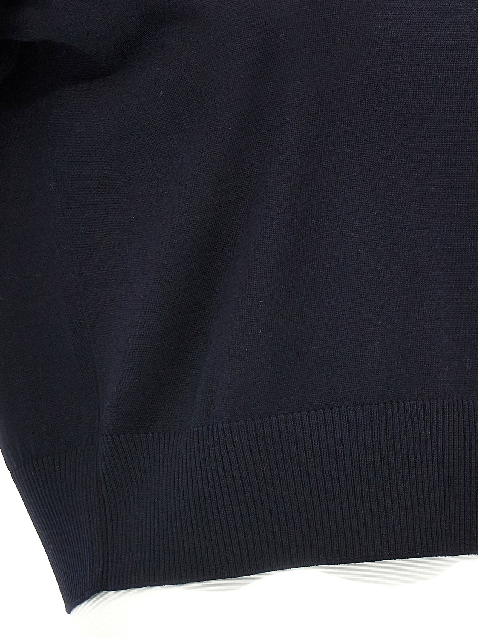 Elevate your style with KHAITE's Morgane crop top, a luxurious wool piece in midnight blue, expertly crafted for timeless elegance and refined allure.