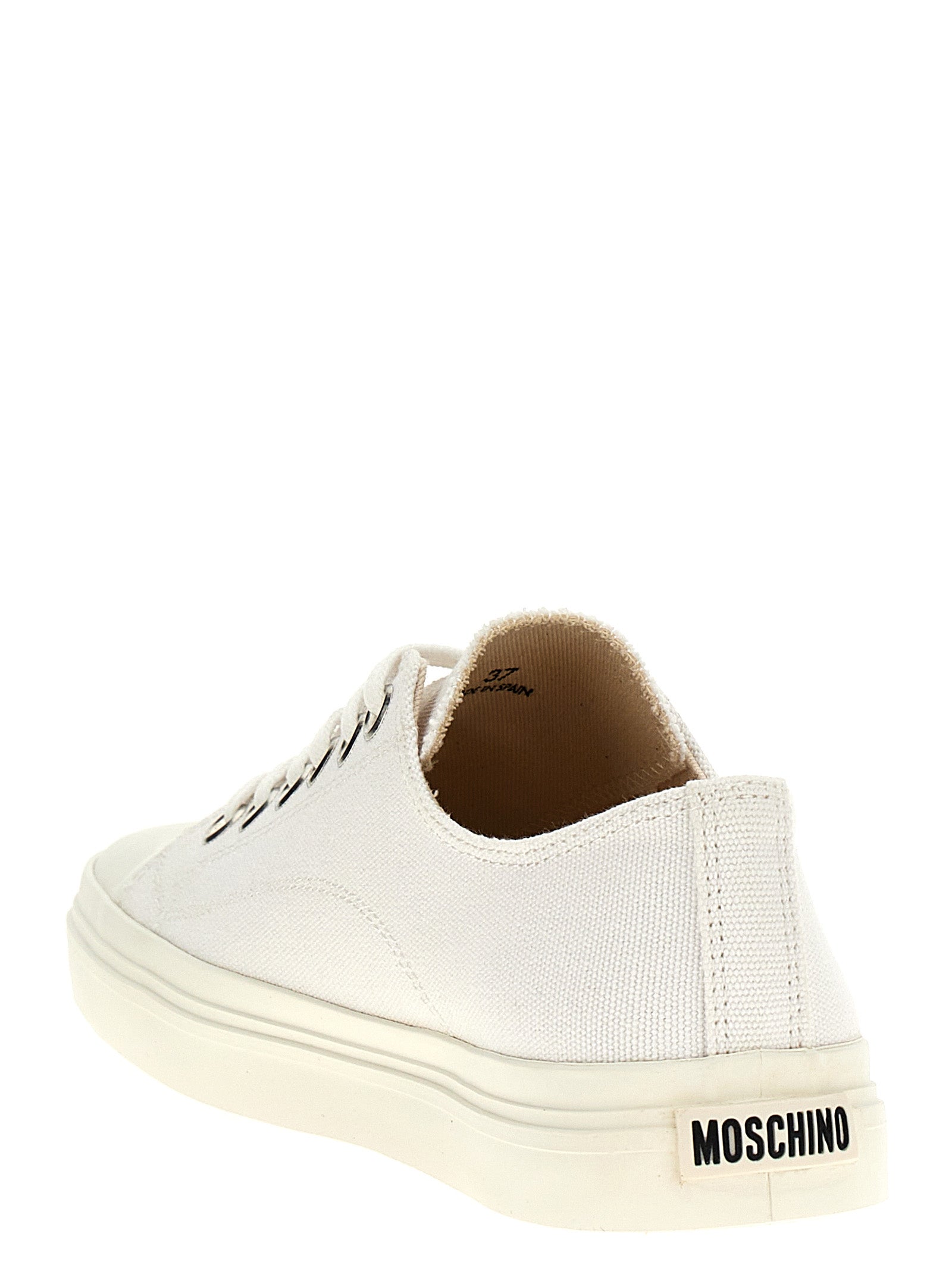 Step into the realm of luxury with Moschino's White Cotton Low Top Sneakers, where exquisite craftsmanship meets timeless elegance for the discerning individual.
