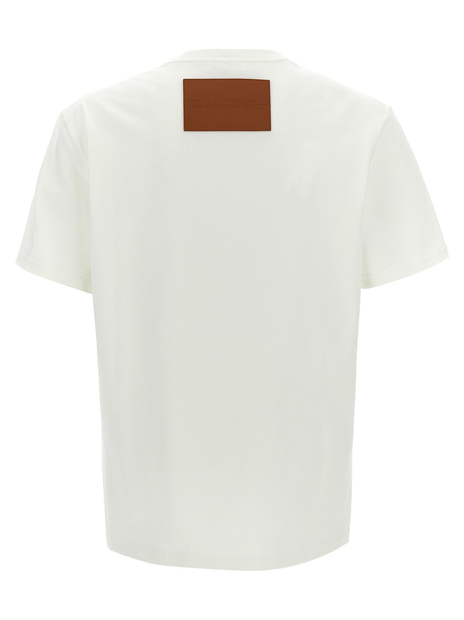 Discover Jil Sander's White Cotton T-Shirt, a masterpiece of Italian craftsmanship, featuring a bold leather logo patch that elevates your style with timeless elegance.
