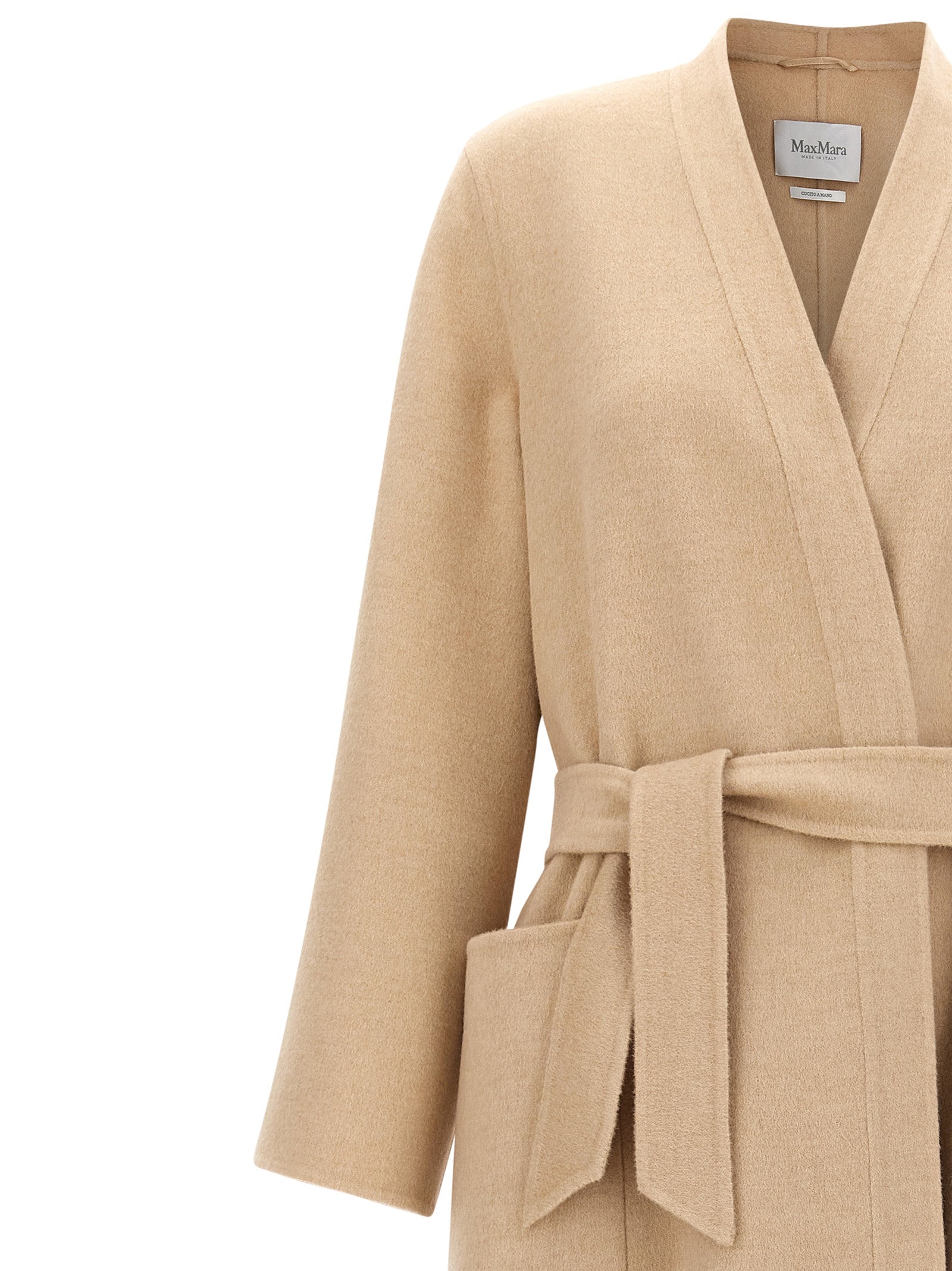 Elevate your wardrobe with the Max Mara Vezzoso coat, crafted from pure camel wool, embodying timeless elegance and artisanal luxury for discerning individuals.