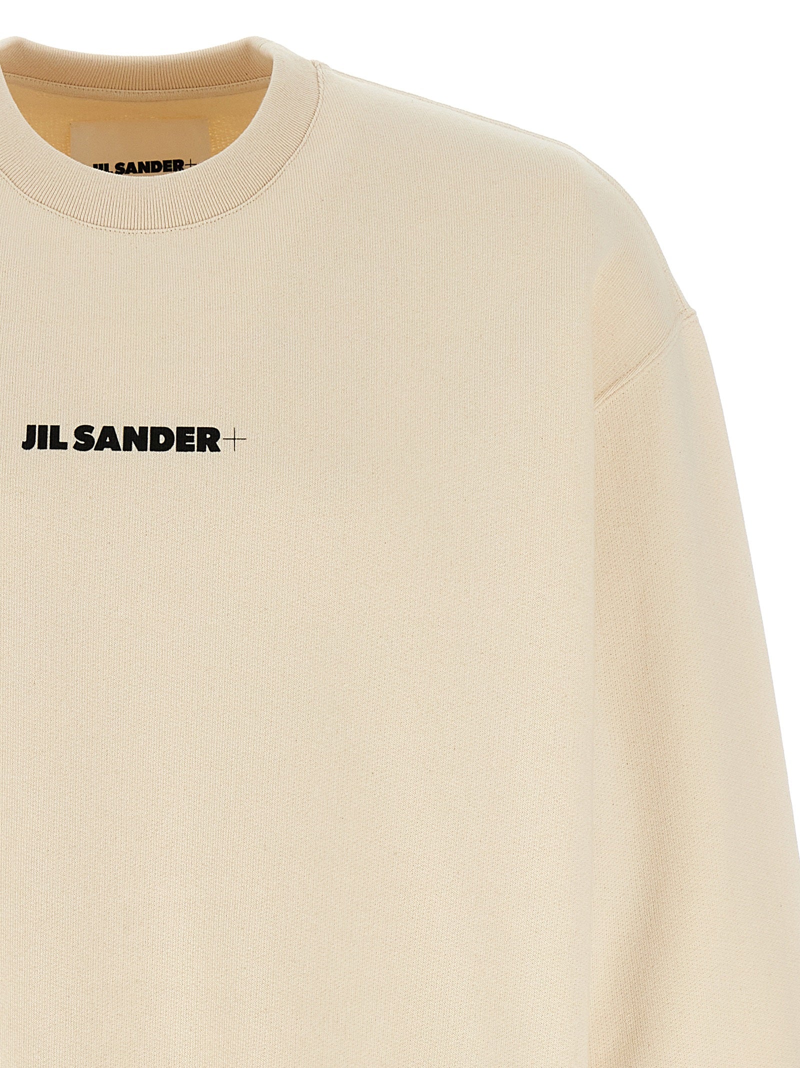 Elevate your wardrobe with the Jil Sander Beige Cotton Sweatshirt, crafted from luxurious brushed cotton, embodying effortless elegance for the discerning individual.