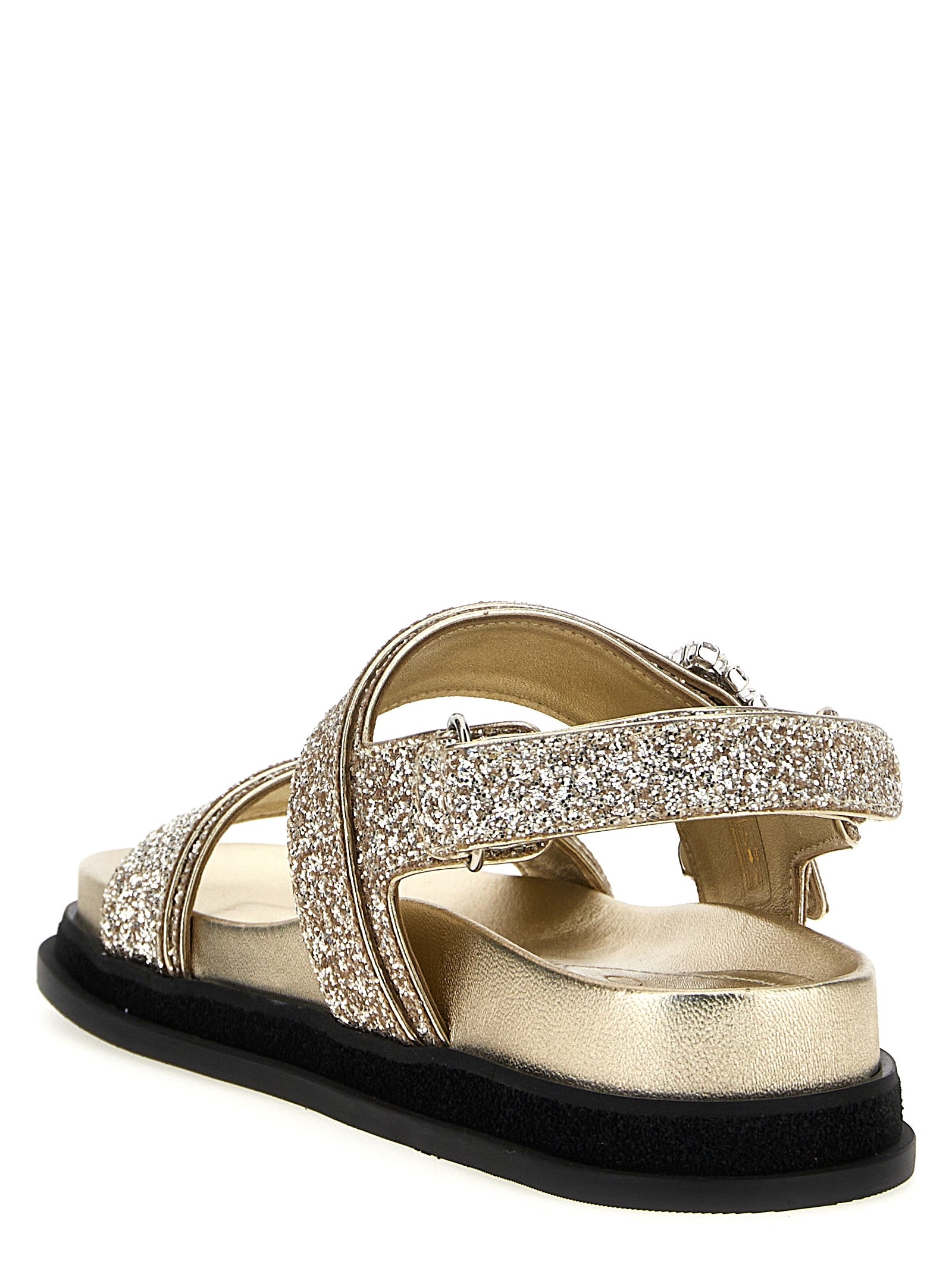 Step into a world of elegance with Jimmy Choo Gold Textile Flat Sandals, where artisanal craftsmanship meets glittering allure, perfect for unforgettable moments.