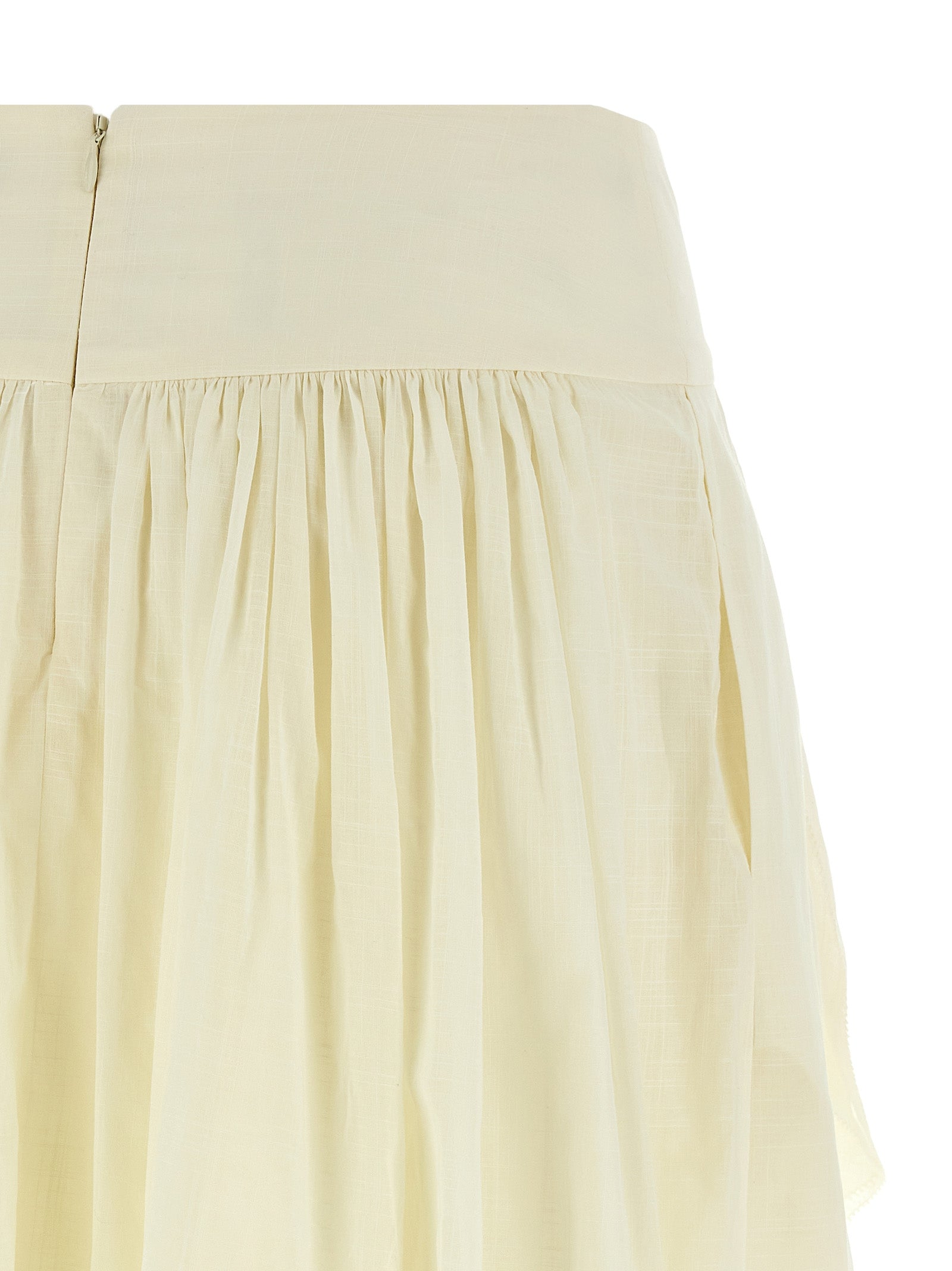 Elevate your elegance with the Zimmermann Acacia Ruffle Mini Skirt, crafted from luxurious cotton, perfect for chic summer soirées and timeless sophistication.