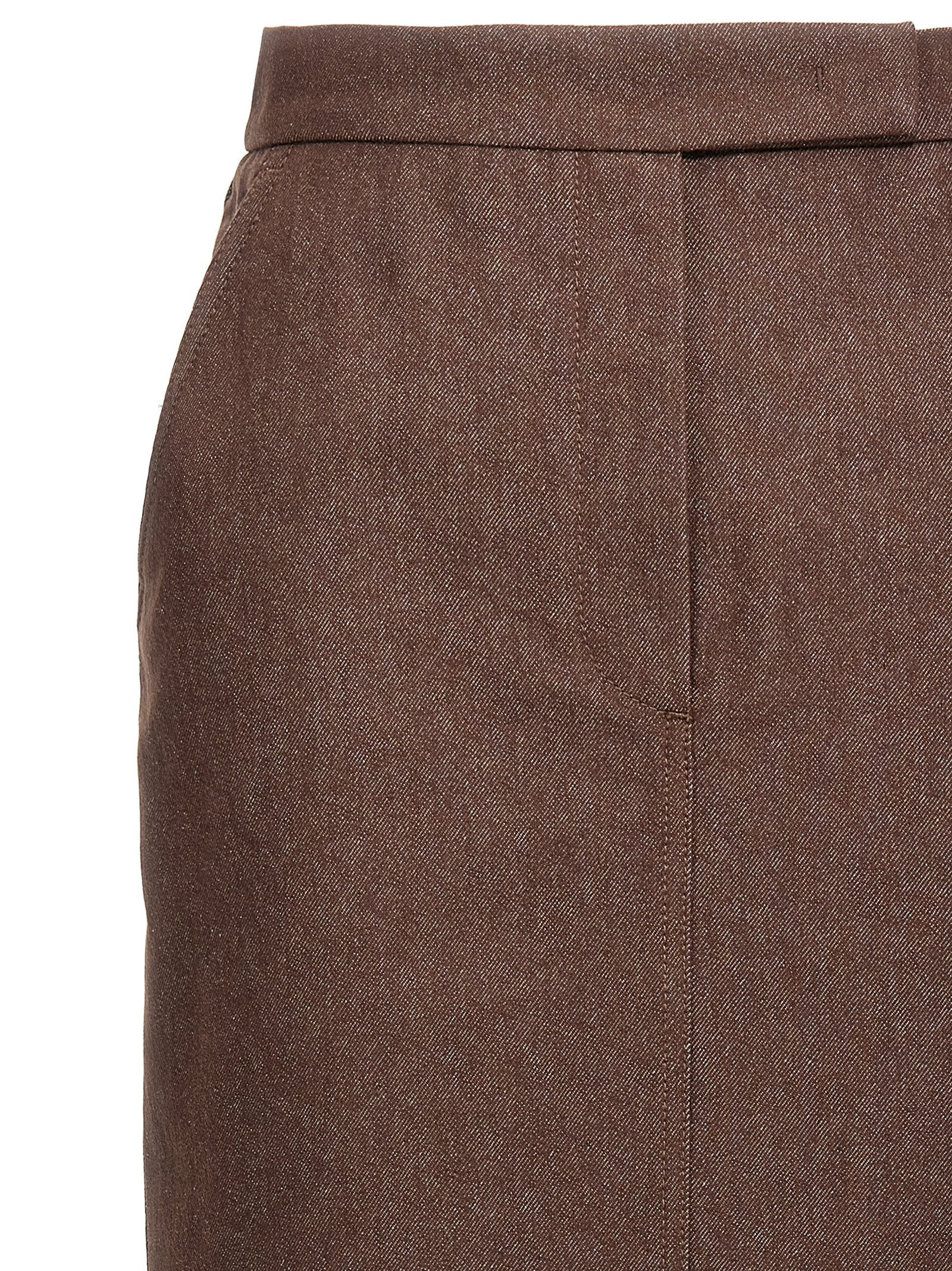 Indulge in the Max Mara Brown Cotton Mini Skirt, a masterpiece of Italian craftsmanship that blends elegance with effortless style for the discerning individual.