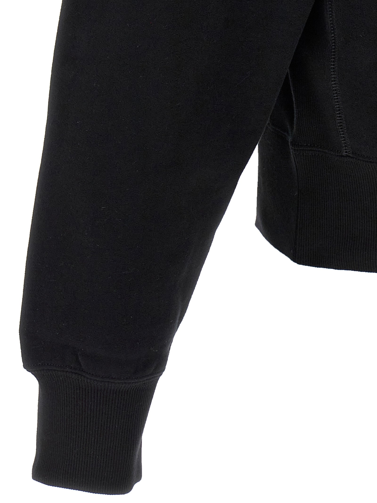 Indulge in the Saint Laurent Black Cotton Sweatshirt, a timeless piece that embodies French elegance and exquisite craftsmanship for the discerning fashion lover.