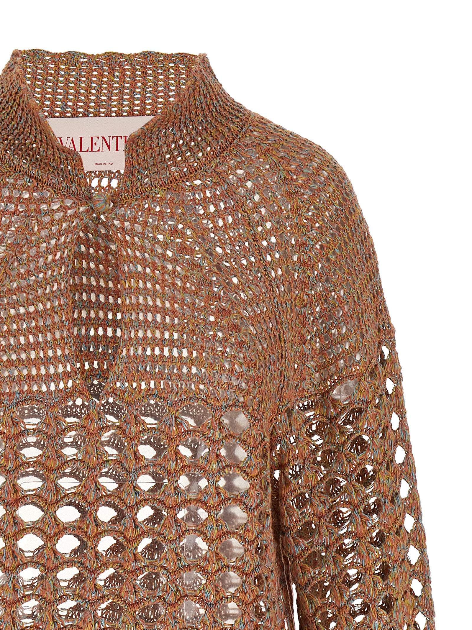 Experience the exquisite artistry of the Valentino Garavani Multicolor Linen Cardigan, a luxurious blend of linen and cotton that embodies timeless elegance and sophistication.