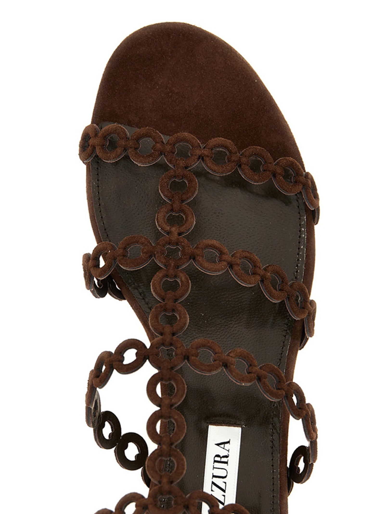 Indulge in Aquazzura's Infinity Chain Gladiator sandals, where sumptuous goat leather meets exquisite craftsmanship, embodying elegance and bold sophistication for the discerning connoisseur.
