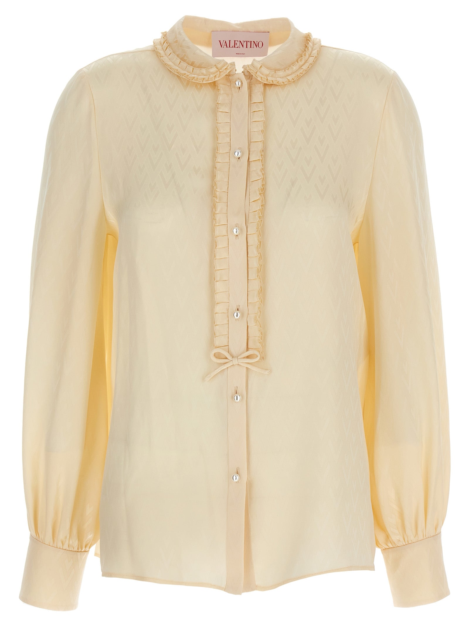 Elevate your wardrobe with the Valentino Garavani Beige Silk Blouse, a masterpiece of artisanal elegance crafted from luxurious silk, perfect for any sophisticated occasion.