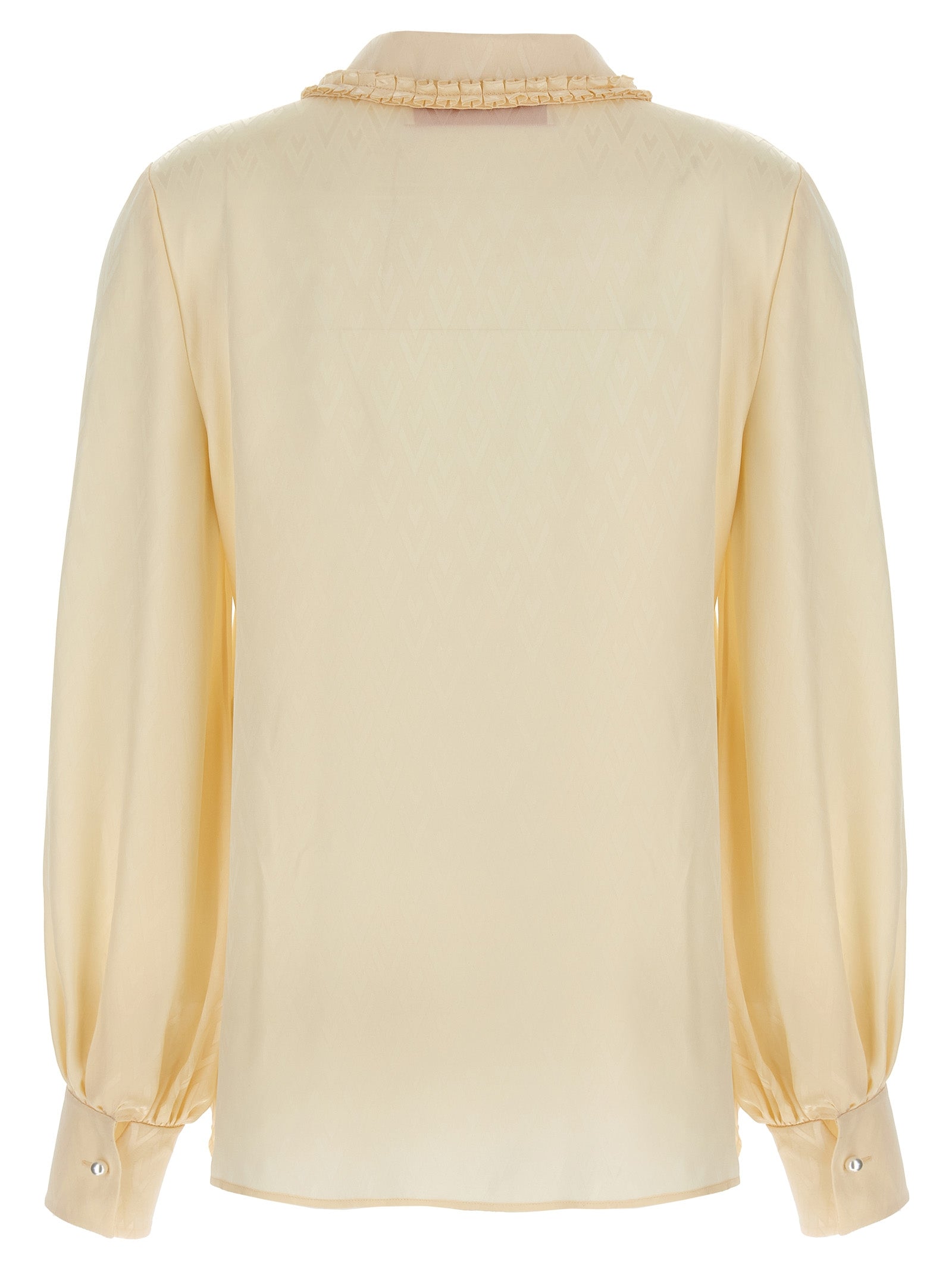 Elevate your wardrobe with the Valentino Garavani Beige Silk Blouse, a timeless masterpiece crafted from luxurious silk, designed for those who appreciate exquisite artistry and sophistication.