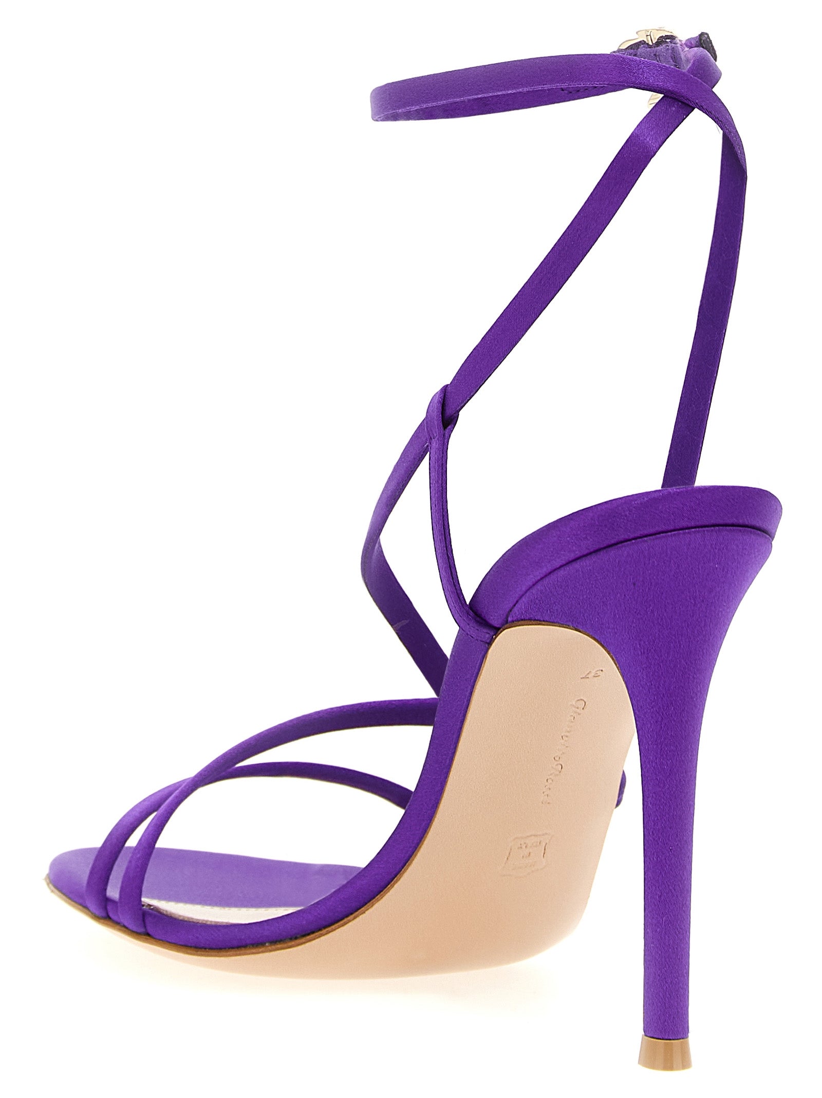 Step into luxury with Gianvito Rossi's Orchid sandals, crafted in radiant purple crêpe satin, embodying elegance and sophistication for the discerning individual.