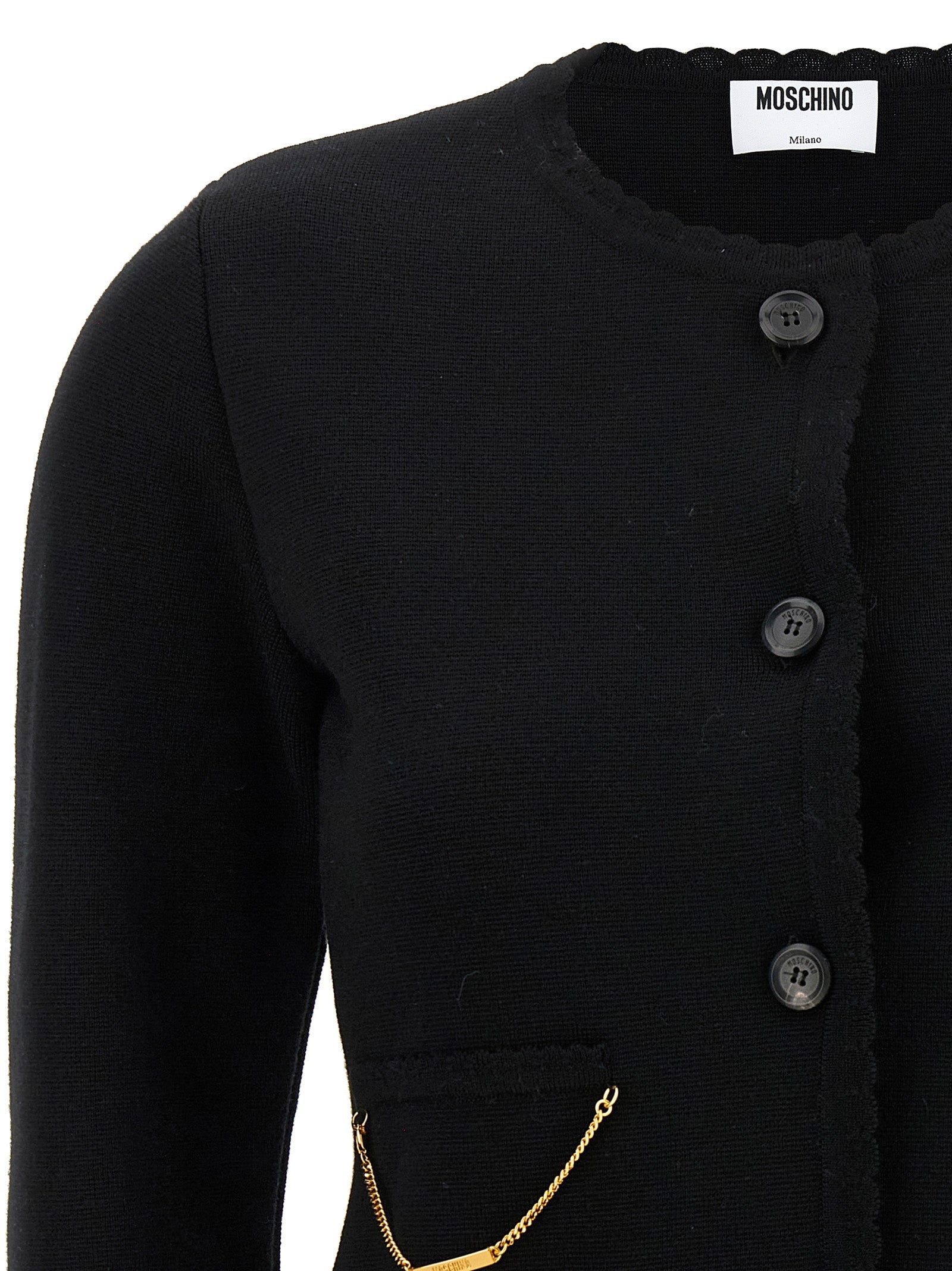 Indulge in the Moschino Black Virgin Wool Cardigan, a masterpiece of artisanal luxury that embodies sophistication and timeless elegance for the discerning connoisseur.