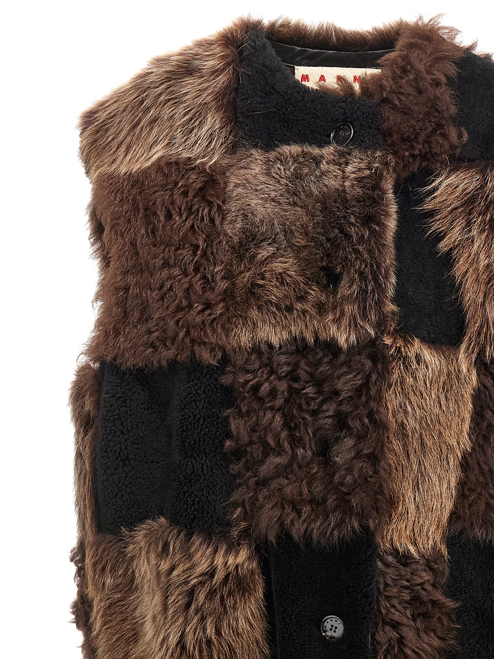 Indulge in the exquisite Marni Brown Lamb Fur Sleeveless Jacket, a masterpiece of Italian craftsmanship, blending luxurious lamb fur with a bold checkerboard design for timeless elegance.