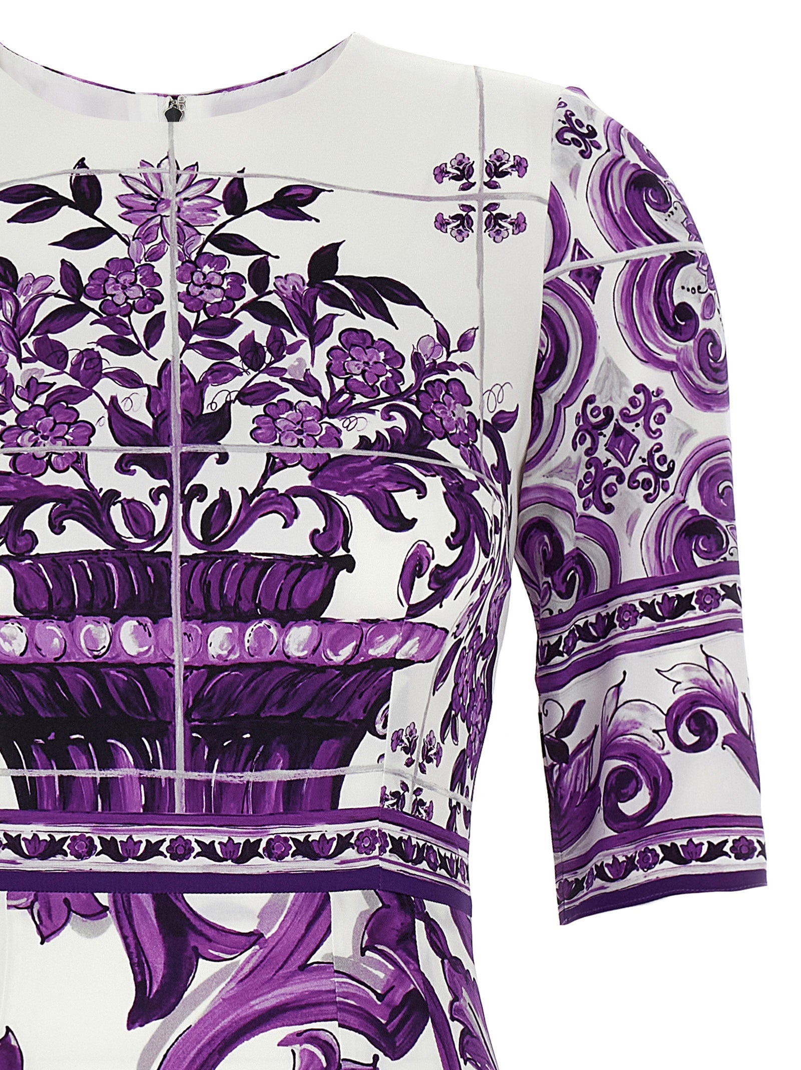 Indulge in the artisanal elegance of the Dolce & Gabbana Purple Silk Midi Dress, a unique masterpiece crafted from luxurious silk, perfect for discerning fashion connoisseurs.