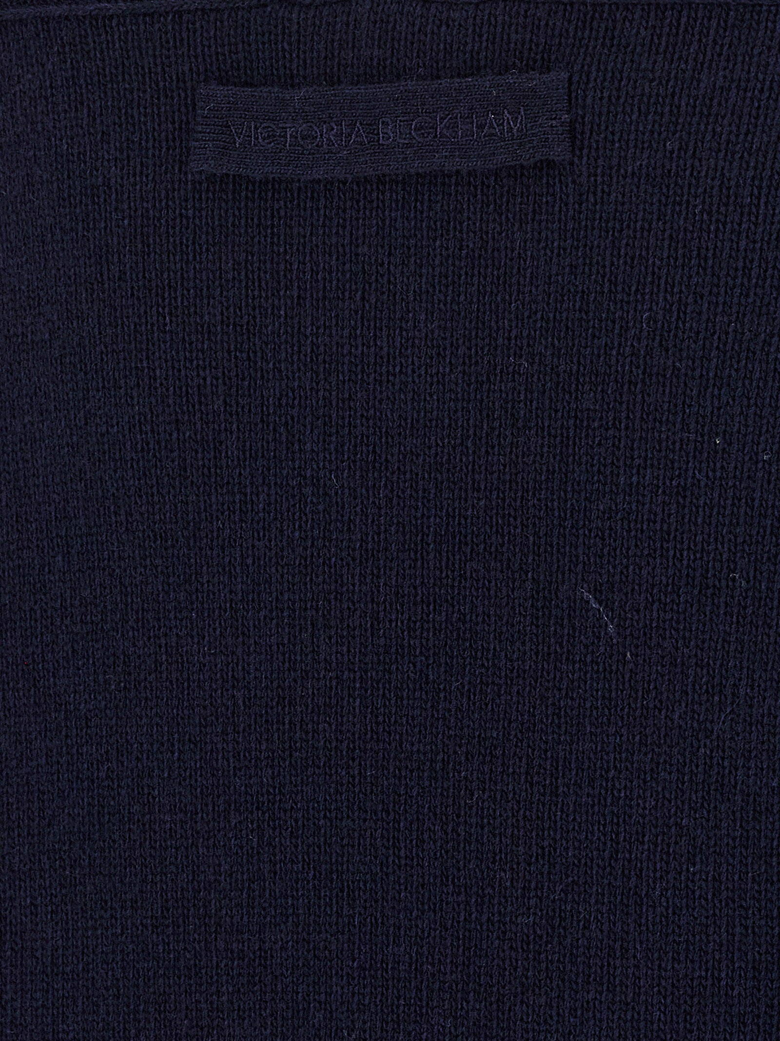 Indulge in the Victoria Beckham Blue Wool Cardigan, a luxurious blend of wool and cashmere, embodying timeless elegance and sophisticated allure for the discerning individual.