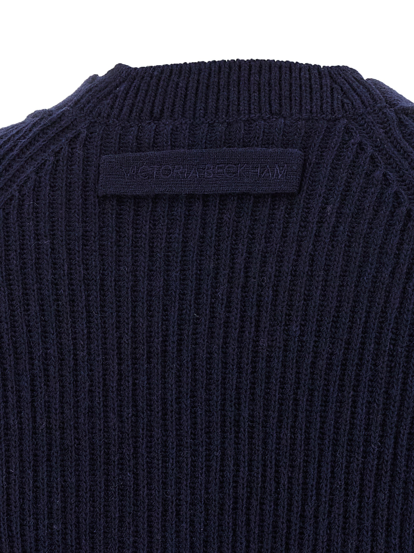 Elevate your wardrobe with the Victoria Beckham Blue Wool Cardigan, a luxurious cashmere blend piece that embodies sophistication and timeless elegance.